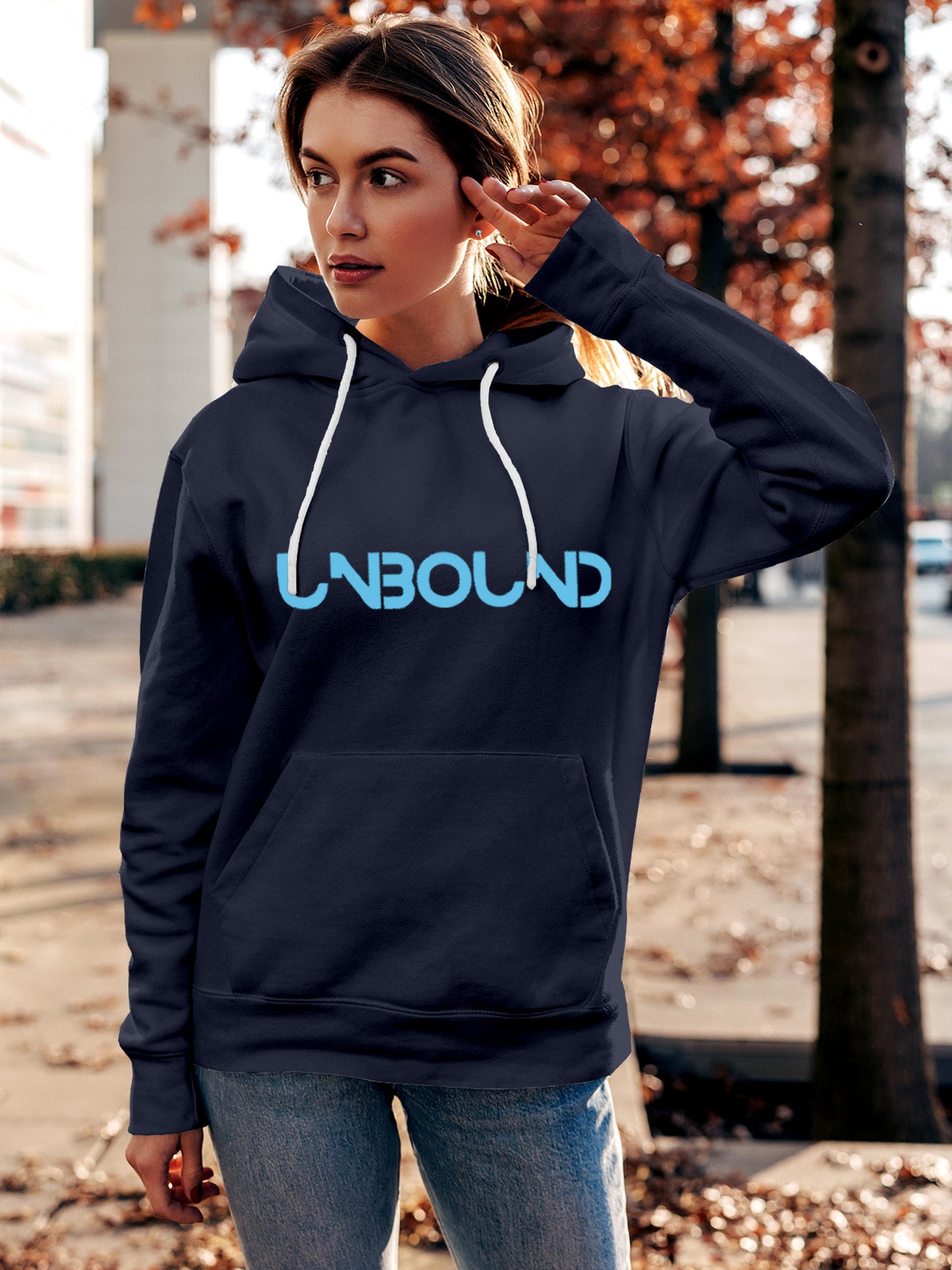 Model wearing Women's Navy Blue Hoodie Sweatshirt with 'Unbound' design, offering effortless style and premium comfort