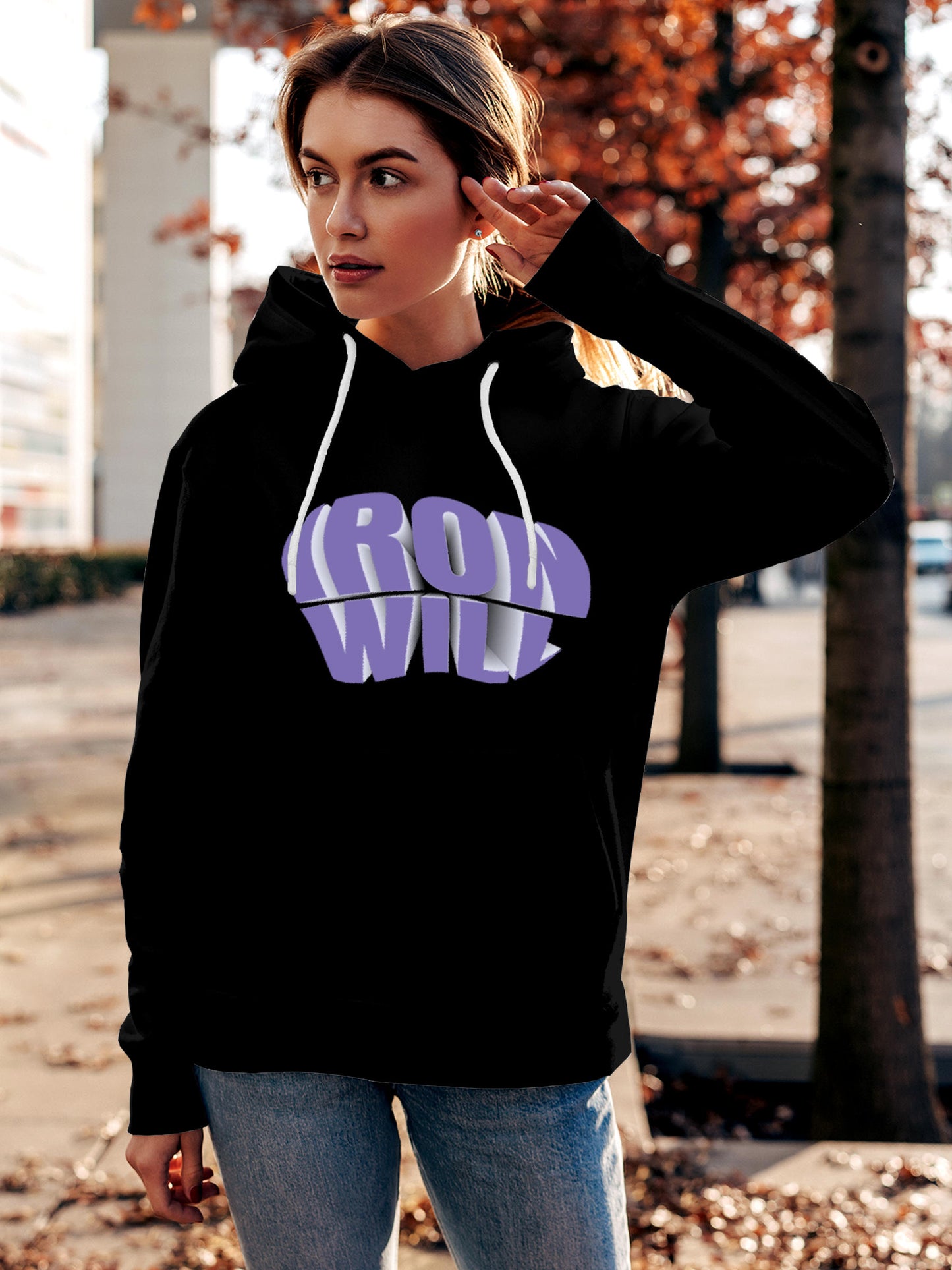 Model wearing Women's Black Hoodie Sweatshirt with 'Iron Will' design, offering effortless style and premium comfort