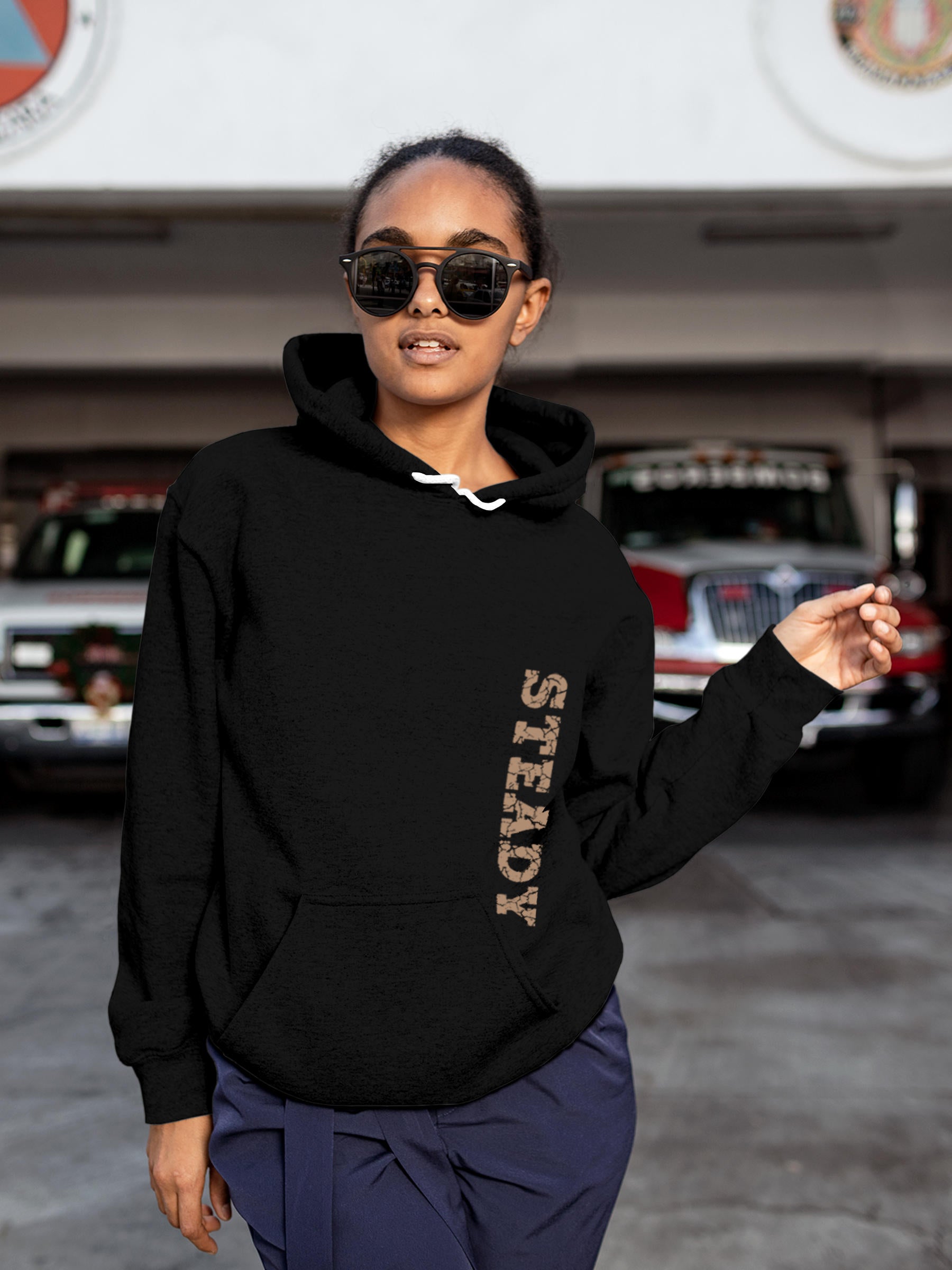 Model wearing Women's Black Hoodie Sweatshirt with 'Steady' design, offering effortless style and premium comfort
