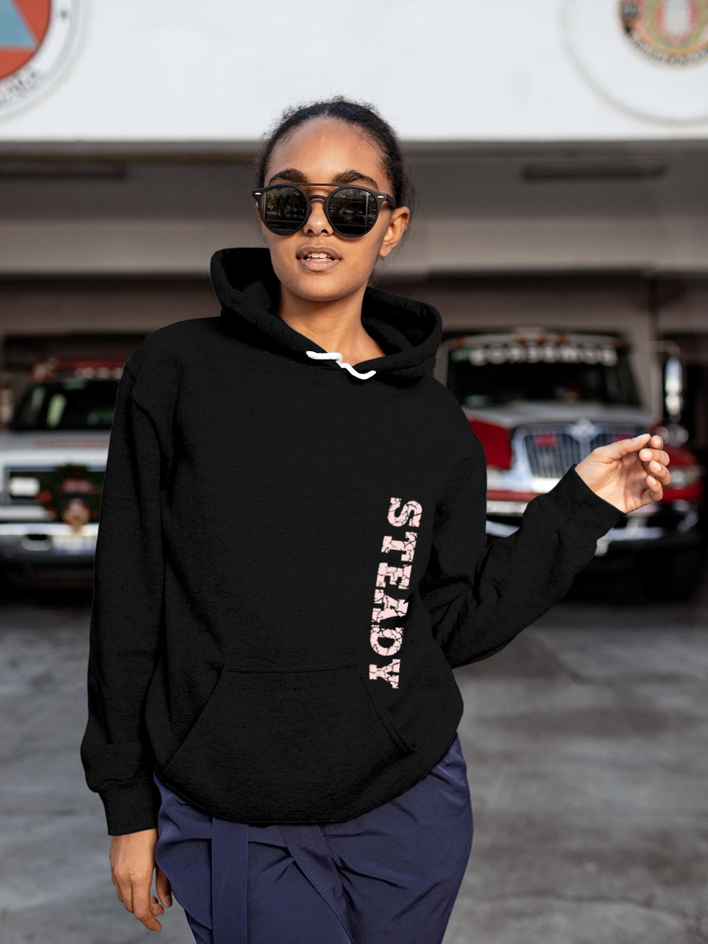 Model wearing Women's Black Hoodie Sweatshirt with 'Steady' design, offering effortless style and premium comfort
