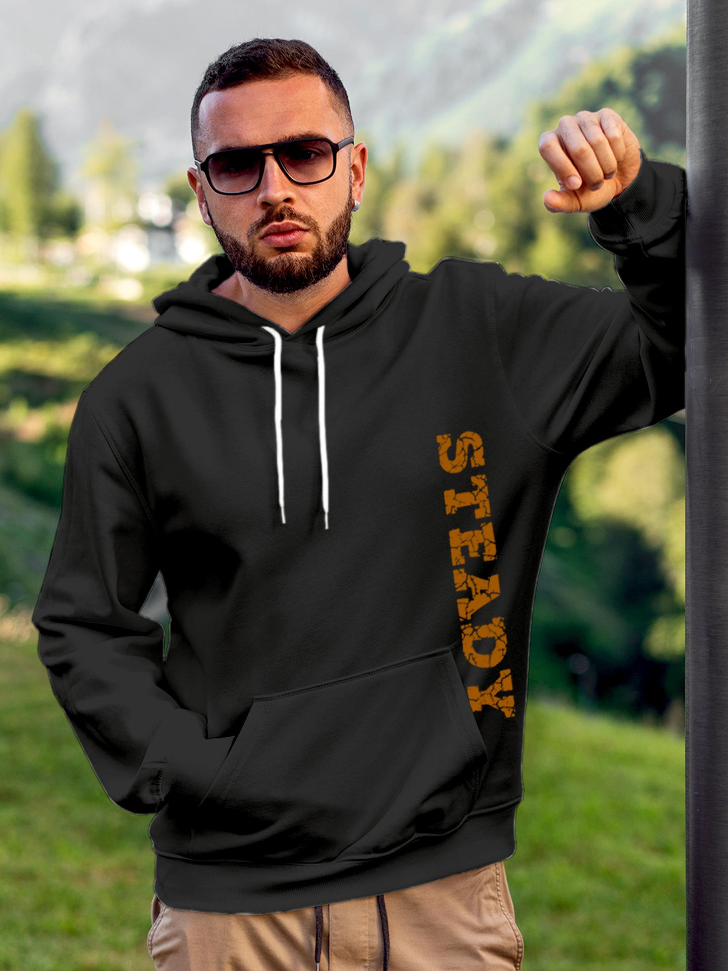 Model wearing Men's Dark Grey Hoodie Sweatshirt with 'Steady' design, offering effortless style and premium comfort