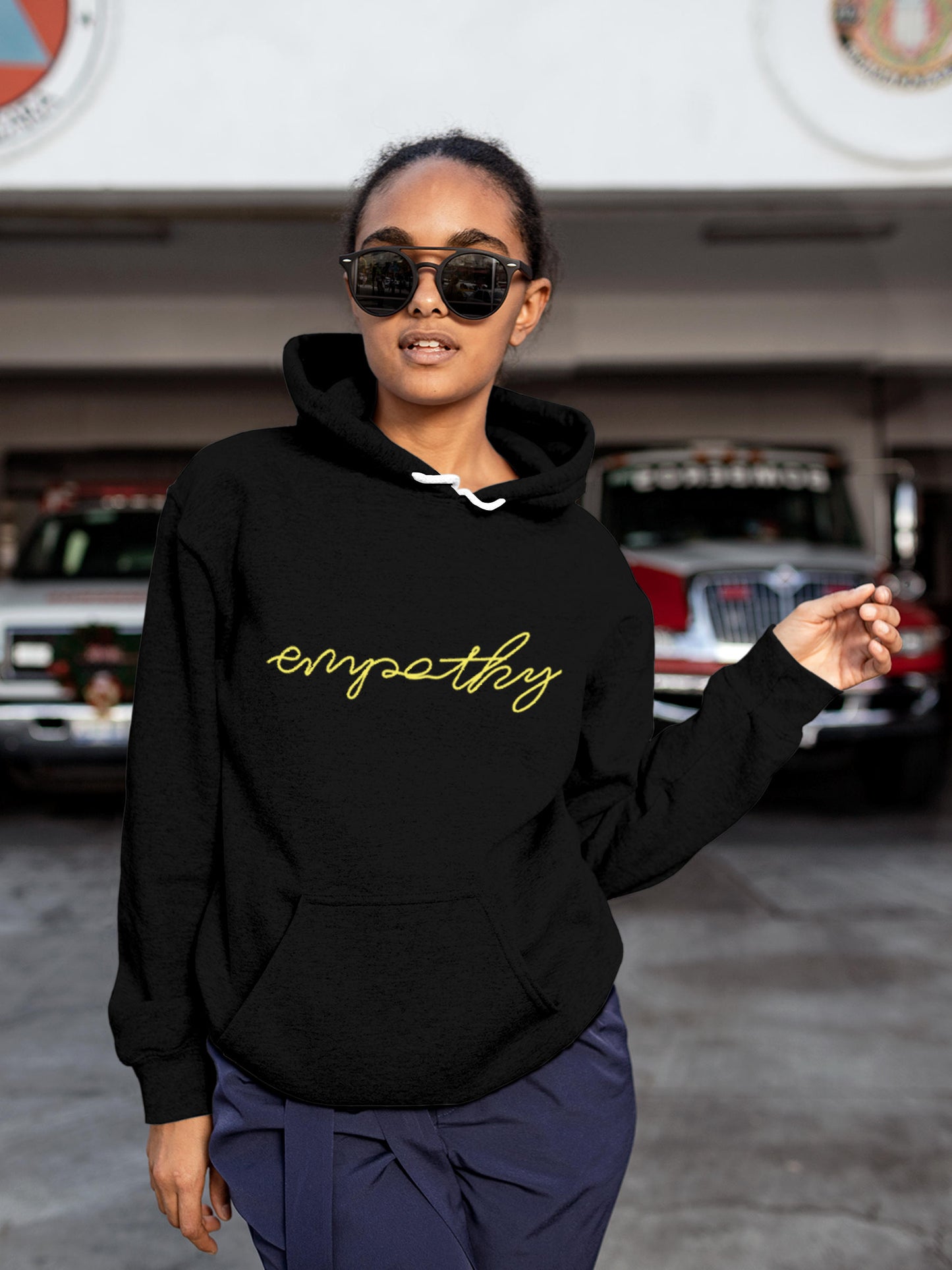 Model wearing Women's Black Hoodie Sweatshirt with 'Empathy' design, offering effortless style and premium comfort