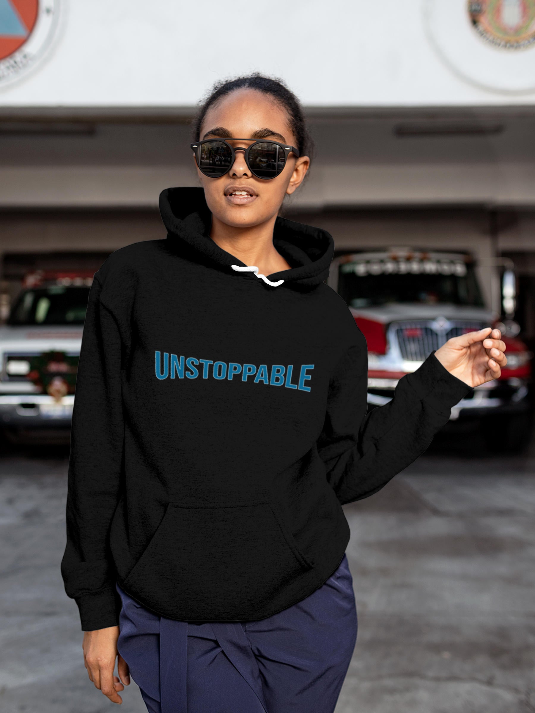Model wearing Women's Black Hoodie Sweatshirt with 'Unstoppable' design, offering effortless style and premium comfort