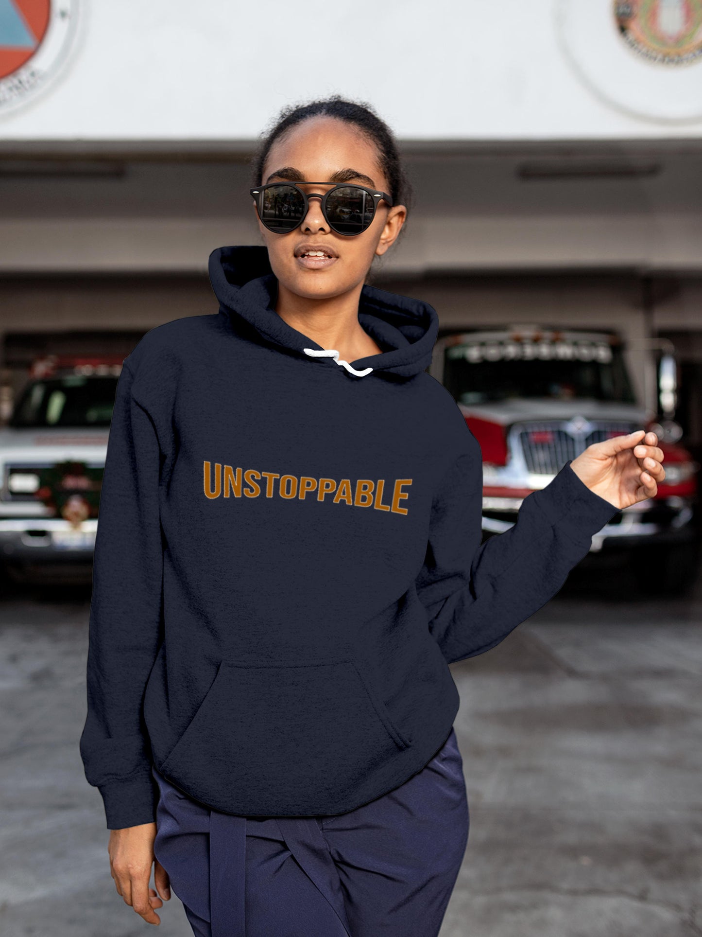 Model wearing Women's Navy Blue Hoodie Sweatshirt with 'Unstoppable' design, offering effortless style and premium comfort