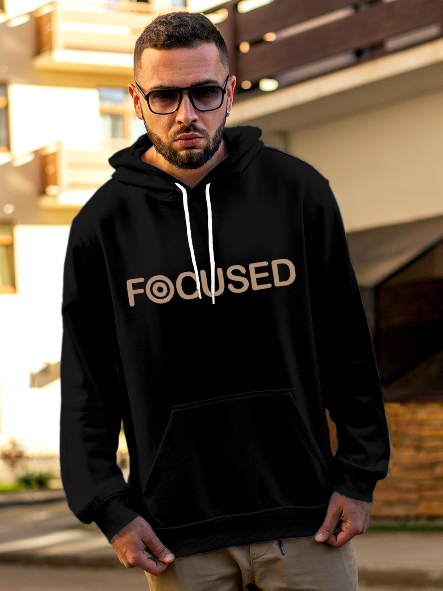 Model wearing Men's Black Hoodie Sweatshirt with 'Focused' design, offering effortless style and premium comfort