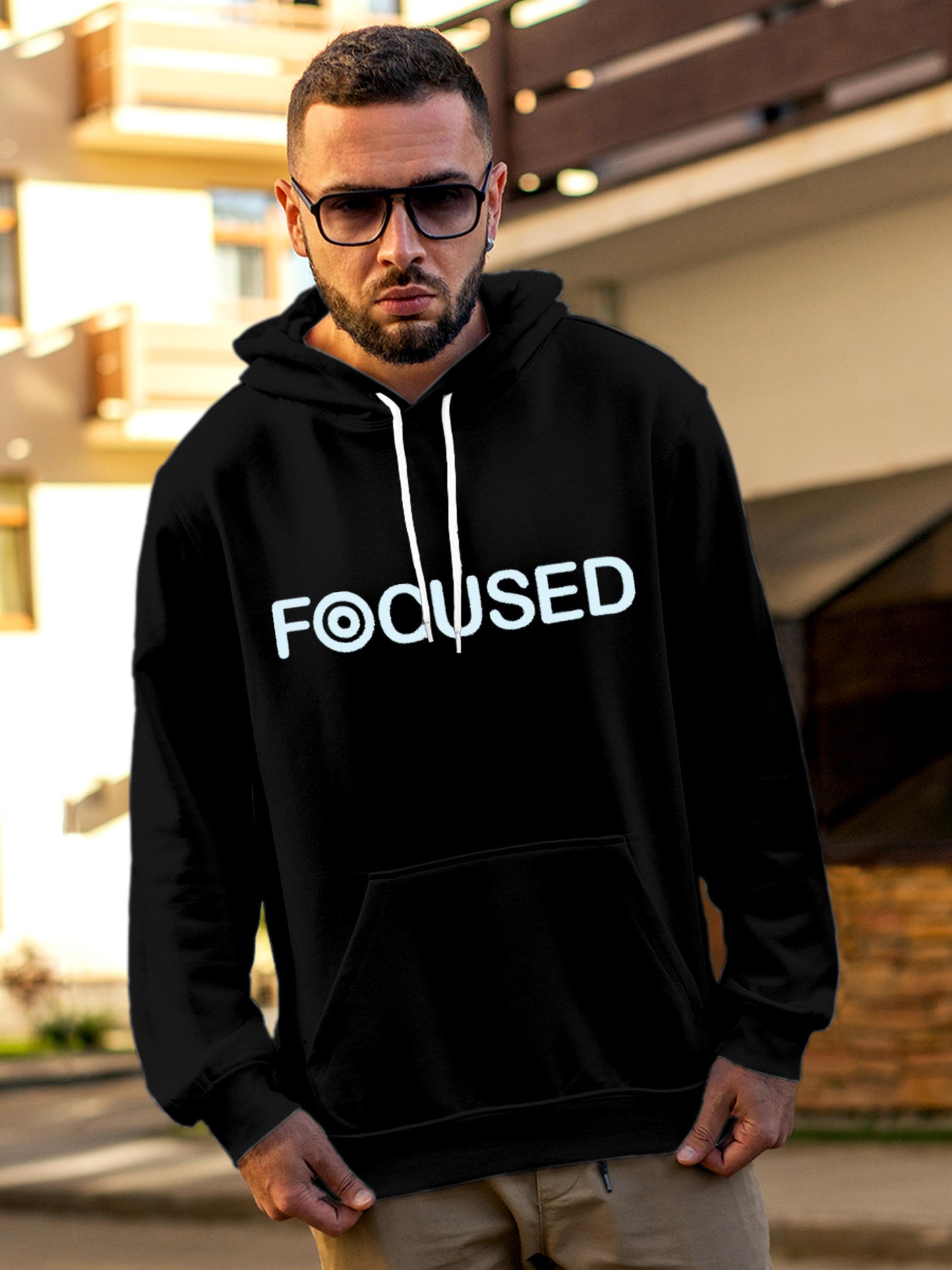 Model wearing Men's Black Hoodie Sweatshirt with 'Focused' design, offering effortless style and premium comfort