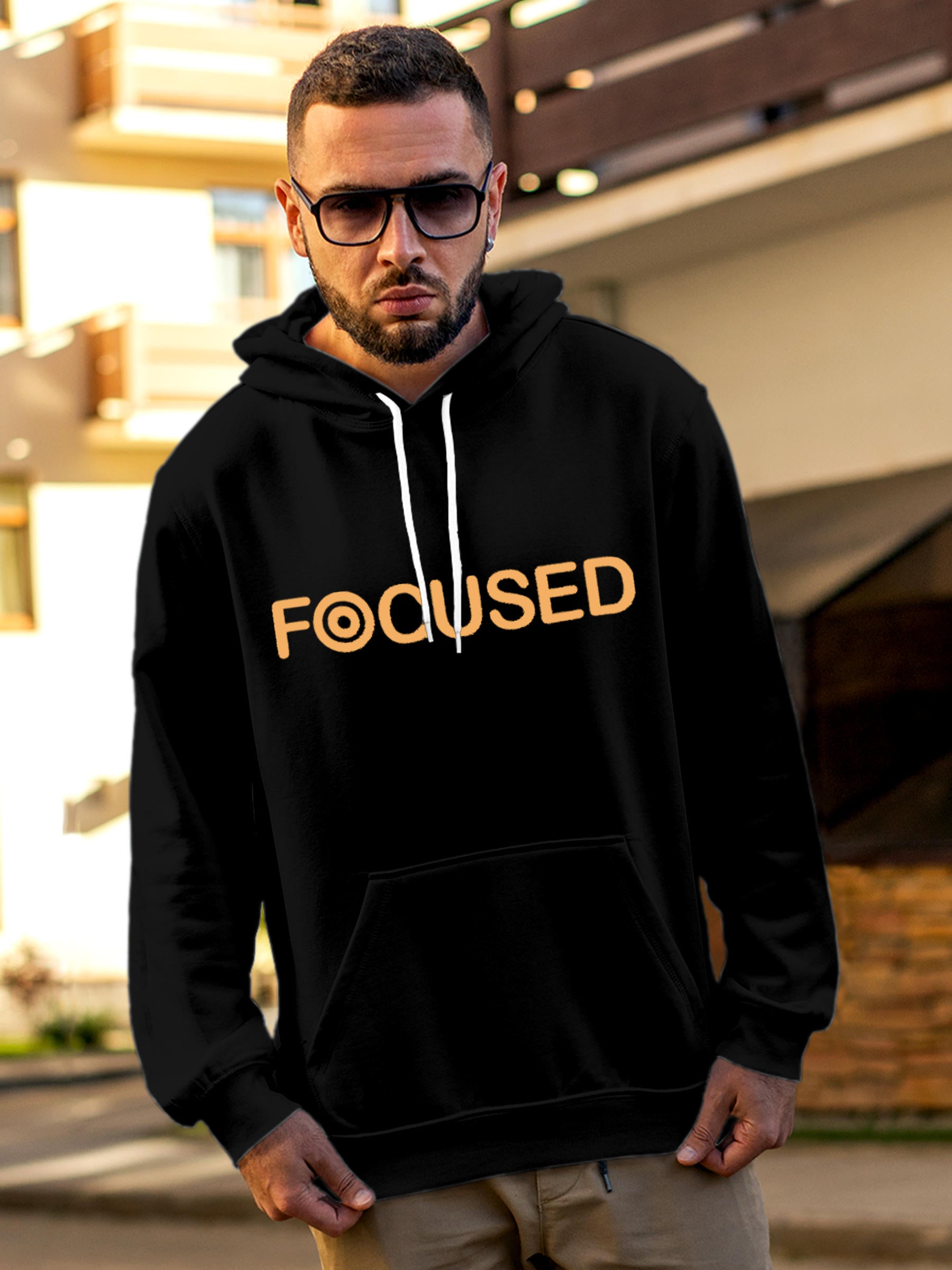 Model wearing Men's Black Hoodie Sweatshirt with 'Focused' design, offering effortless style and premium comfort