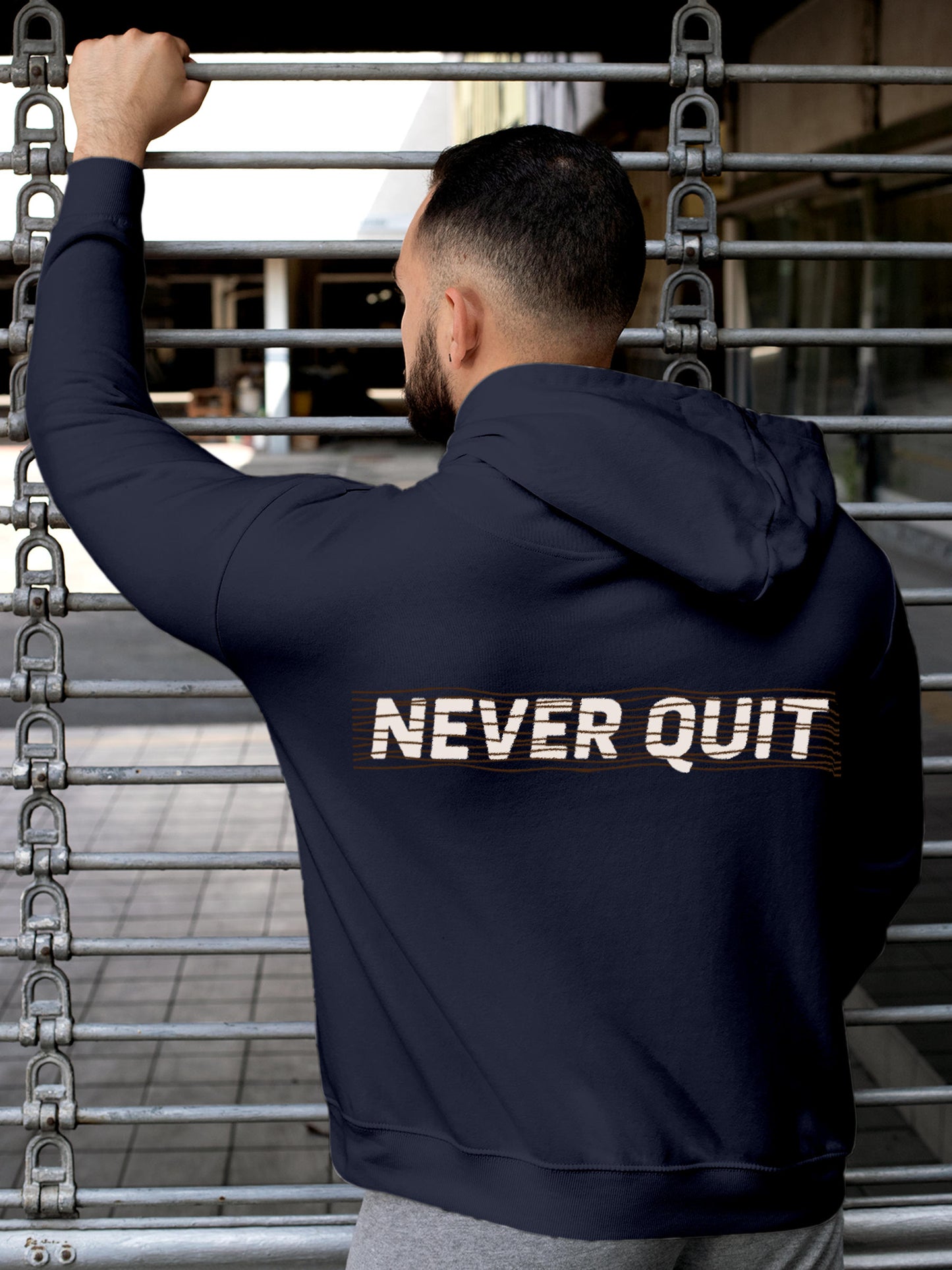 Model wearing Men's Navy Blue Hoodie Sweatshirt with 'Never Quit' design, offering effortless style and premium comfort