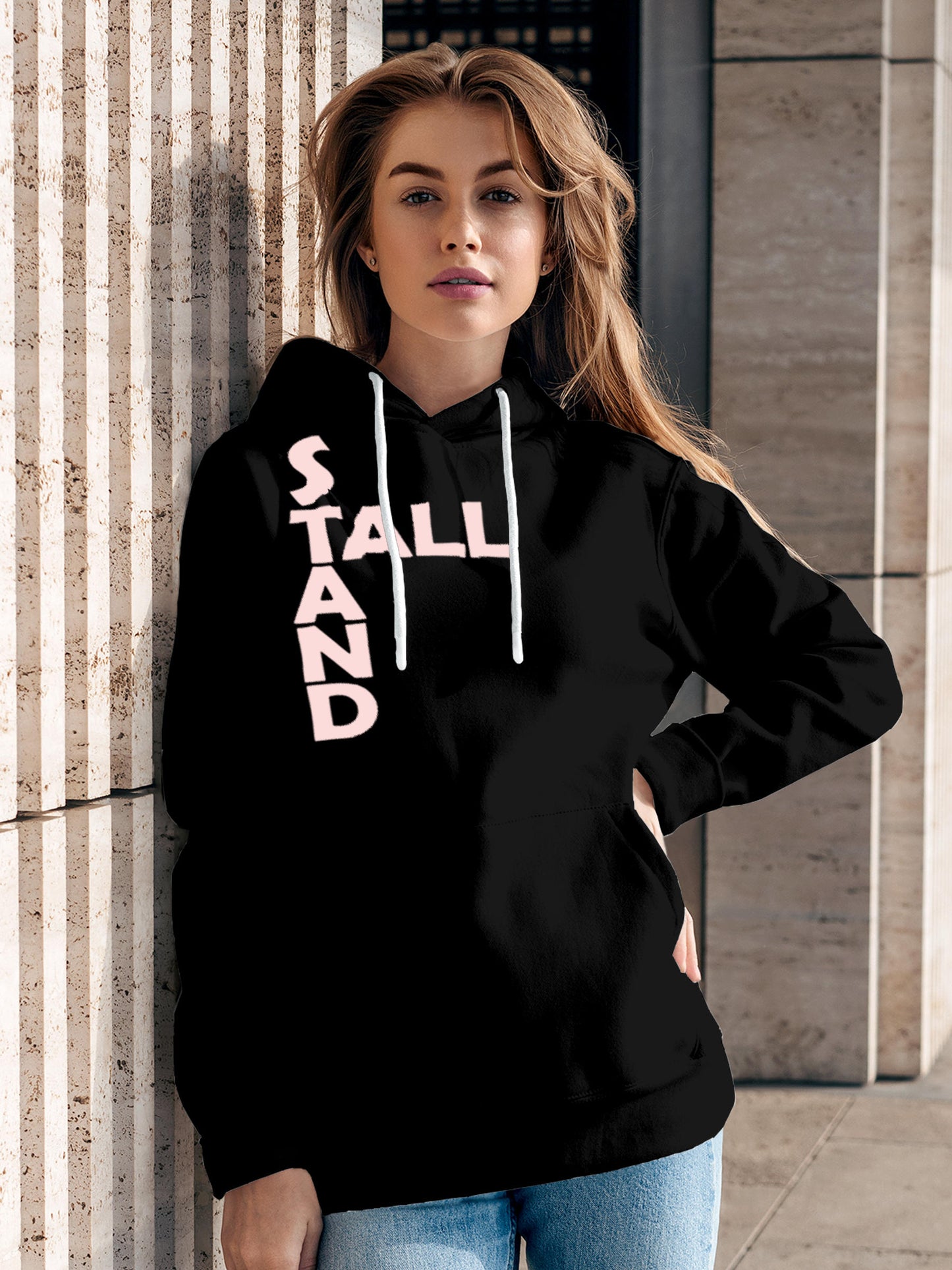 Model wearing Women's Black Hoodie Sweatshirt with 'Stand Tall' design, offering effortless style and premium comfort