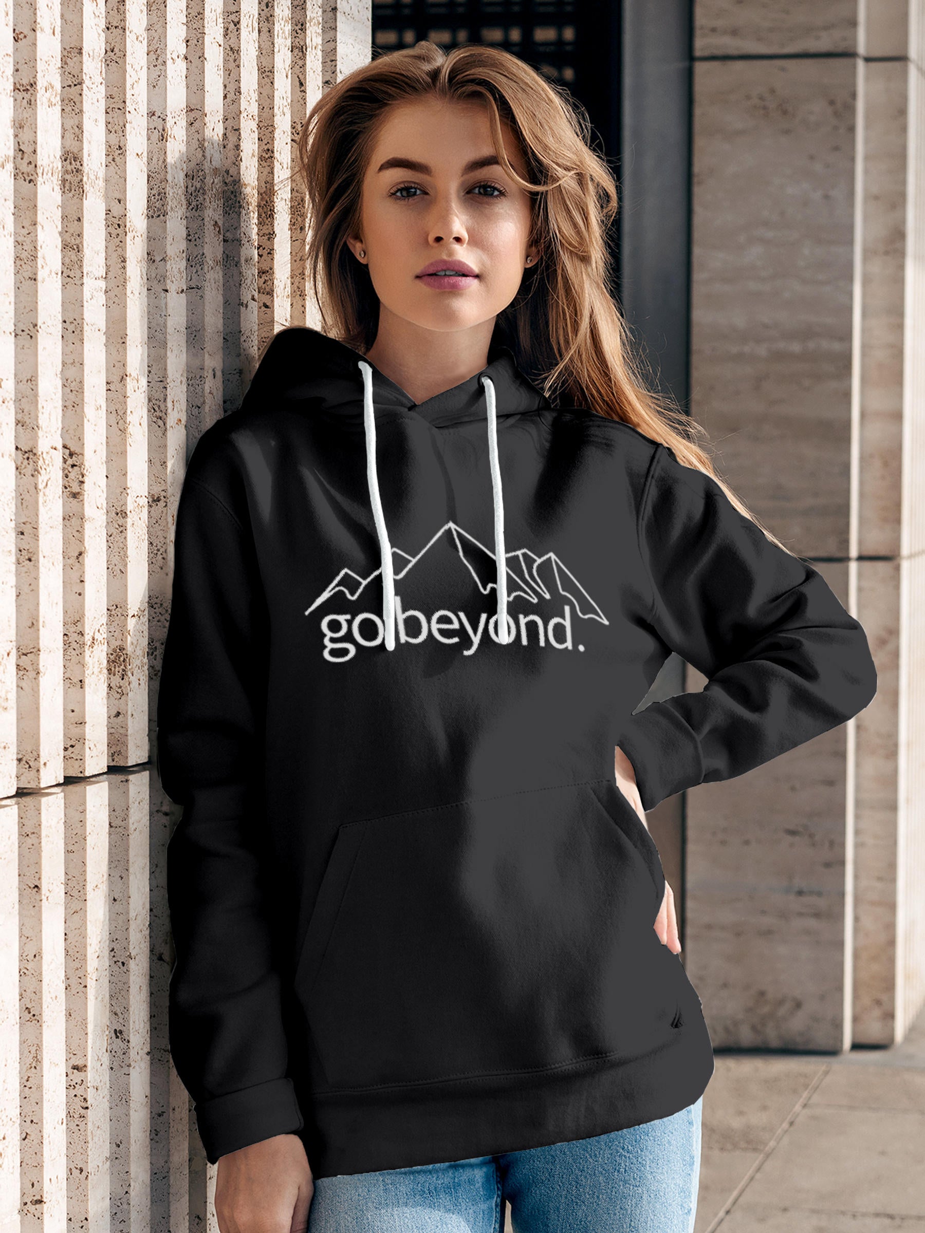 Model wearing Women's Dark Grey Hoodie Sweatshirt with 'Go Beyond' design, offering effortless style and premium comfort