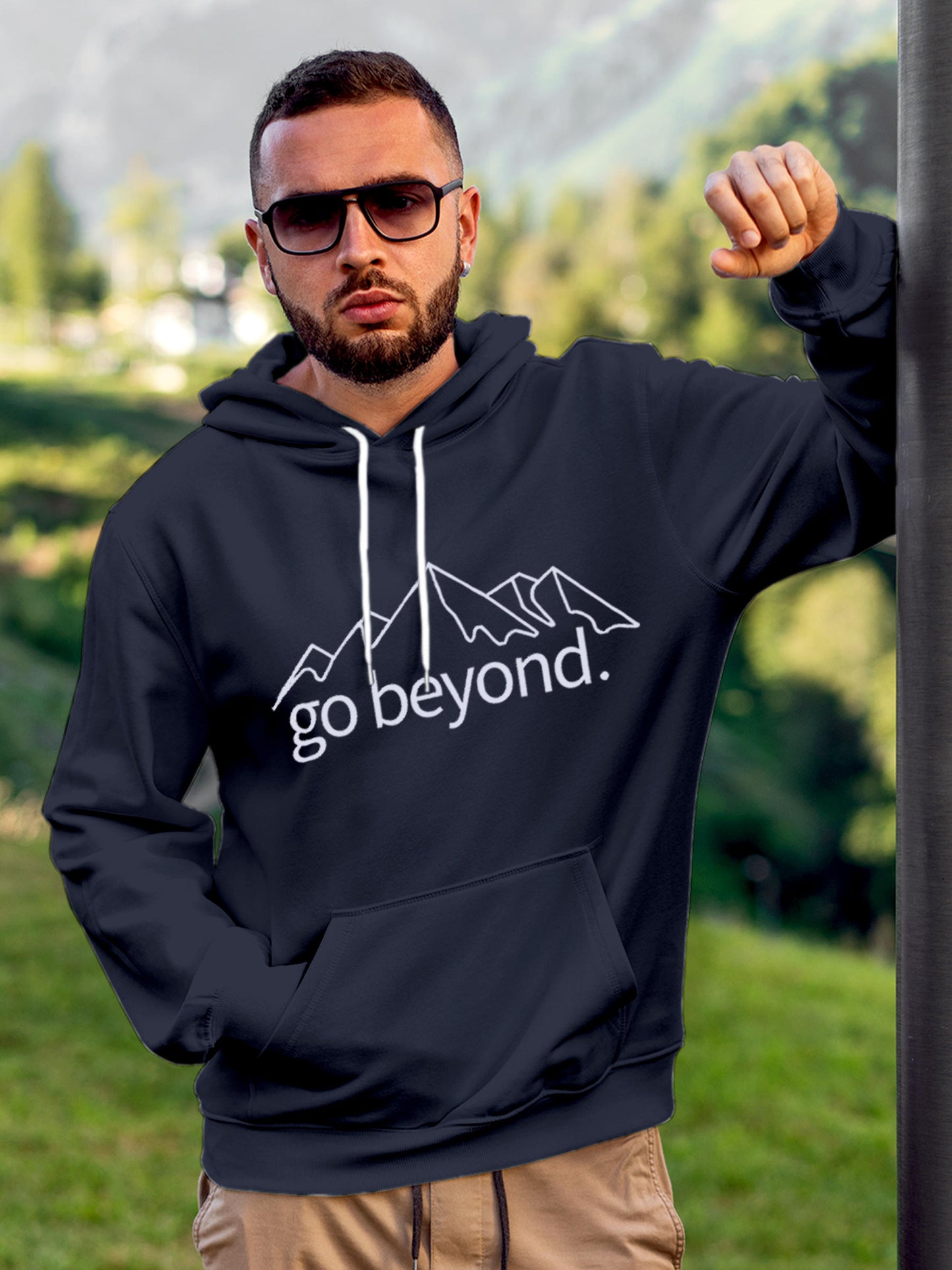 Model wearing Men's Navy Blue Hoodie Sweatshirt with 'Go Beyond' design, offering effortless style and premium comfort