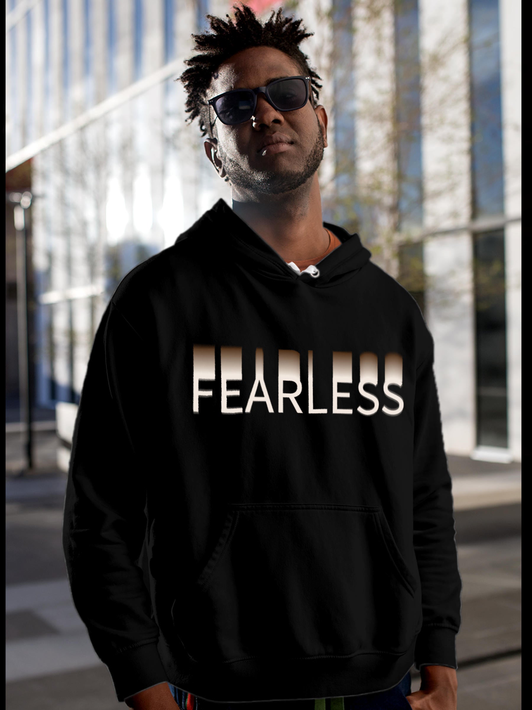 Model wearing Men's Black Hoodie Sweatshirt with 'Fearless' design, offering effortless style and premium comfort