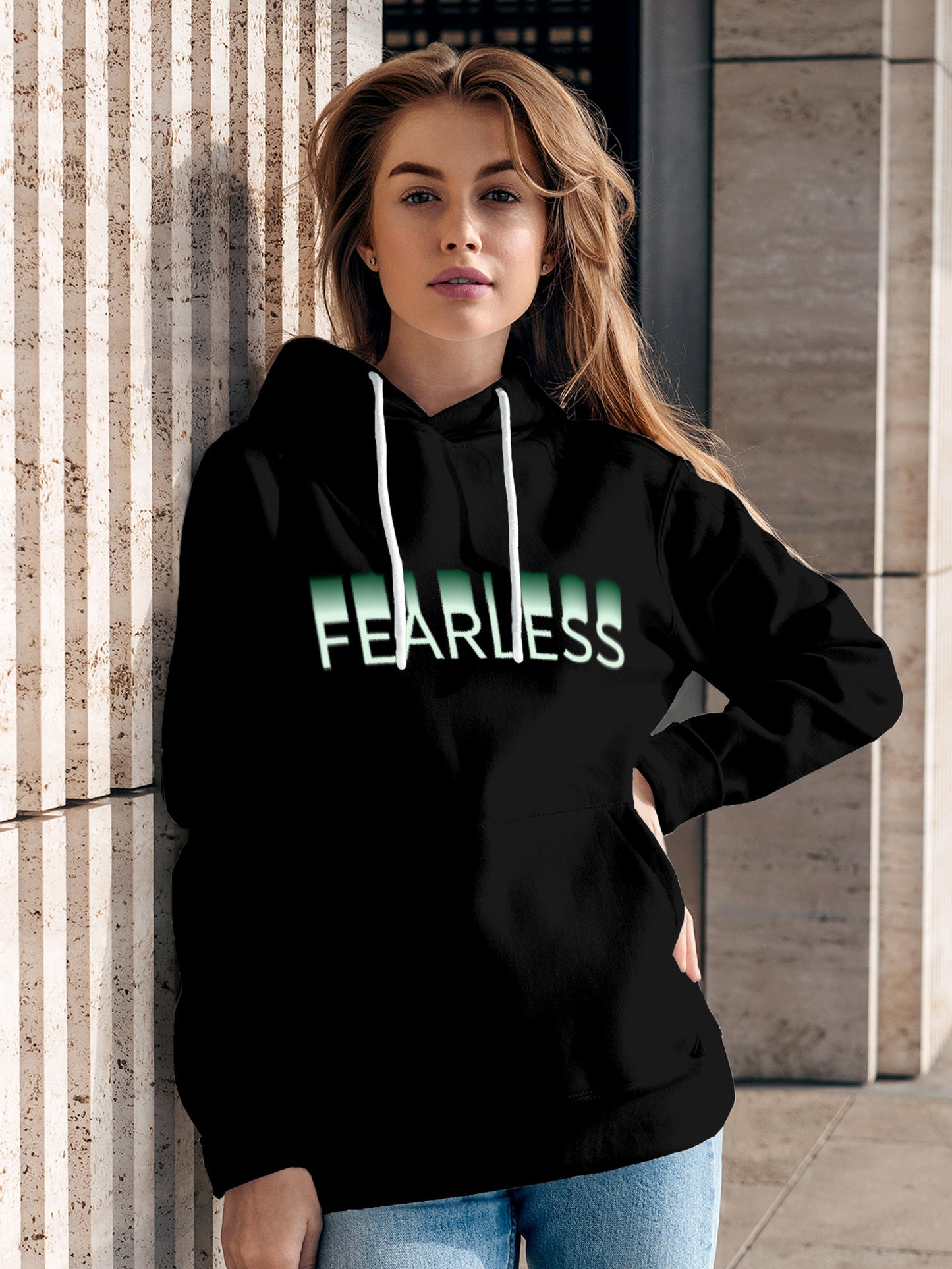 Model wearing Women's Black Hoodie Sweatshirt with 'Fearless' design, offering effortless style and premium comfort