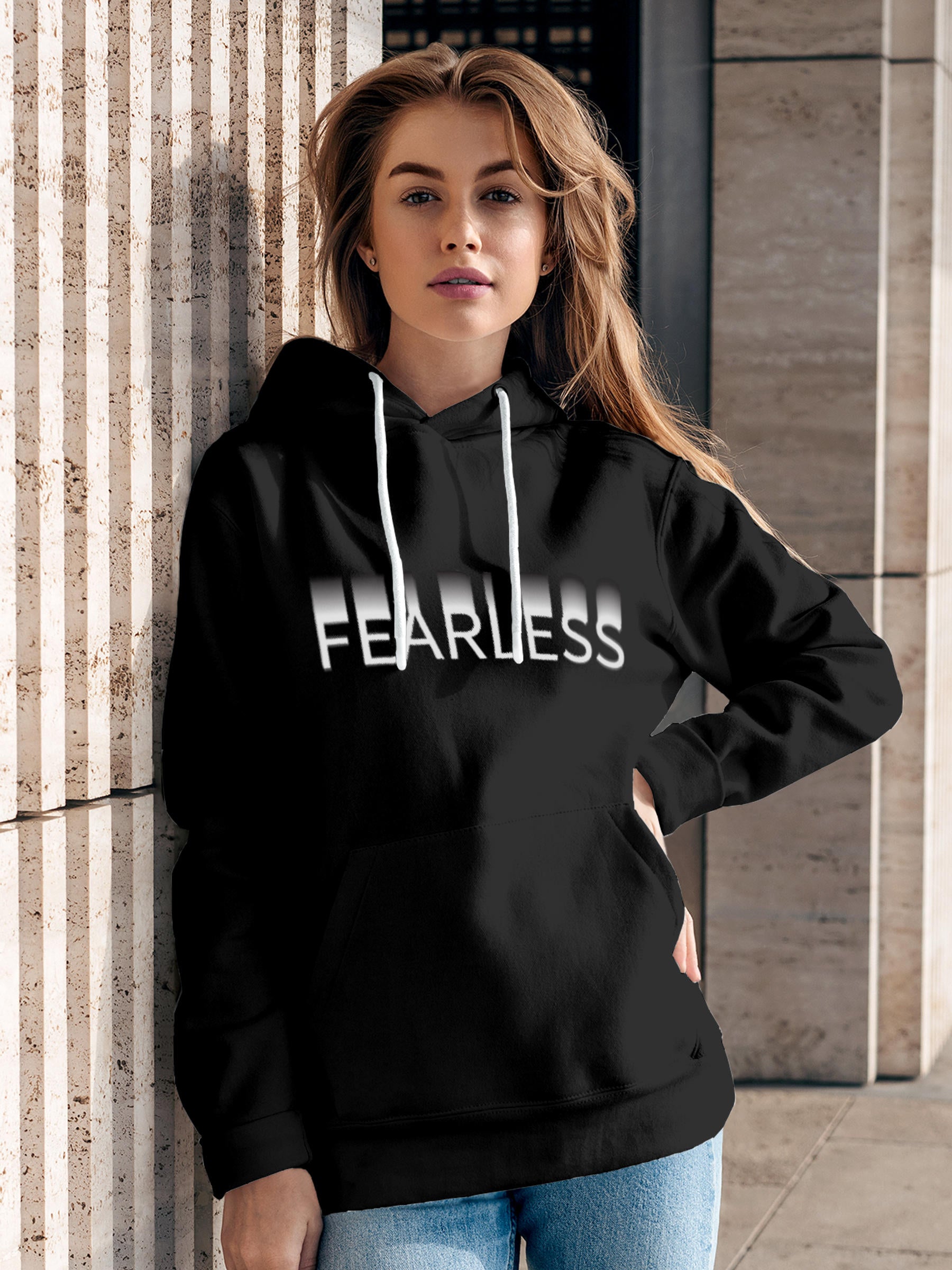 Model wearing Women's Dark Grey Hoodie Sweatshirt with 'Fearless' design, offering effortless style and premium comfort