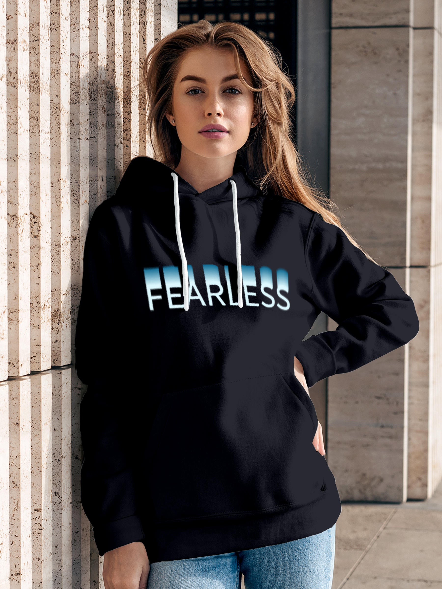 Model wearing Women's Navy Blue Hoodie Sweatshirt with 'Fearless' design, offering effortless style and premium comfort