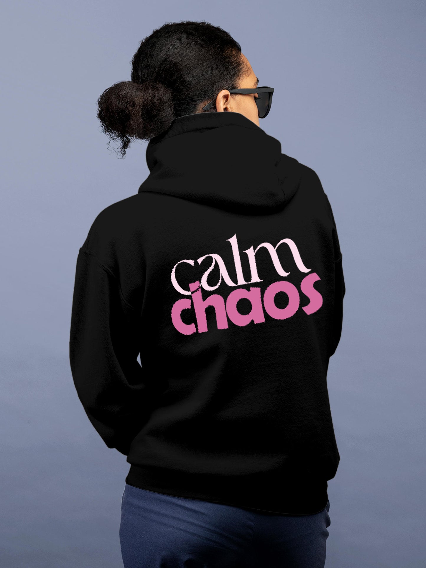 Model wearing Women's Black Hoodie Sweatshirt with 'Calm Chaos' design, offering effortless style and premium comfort