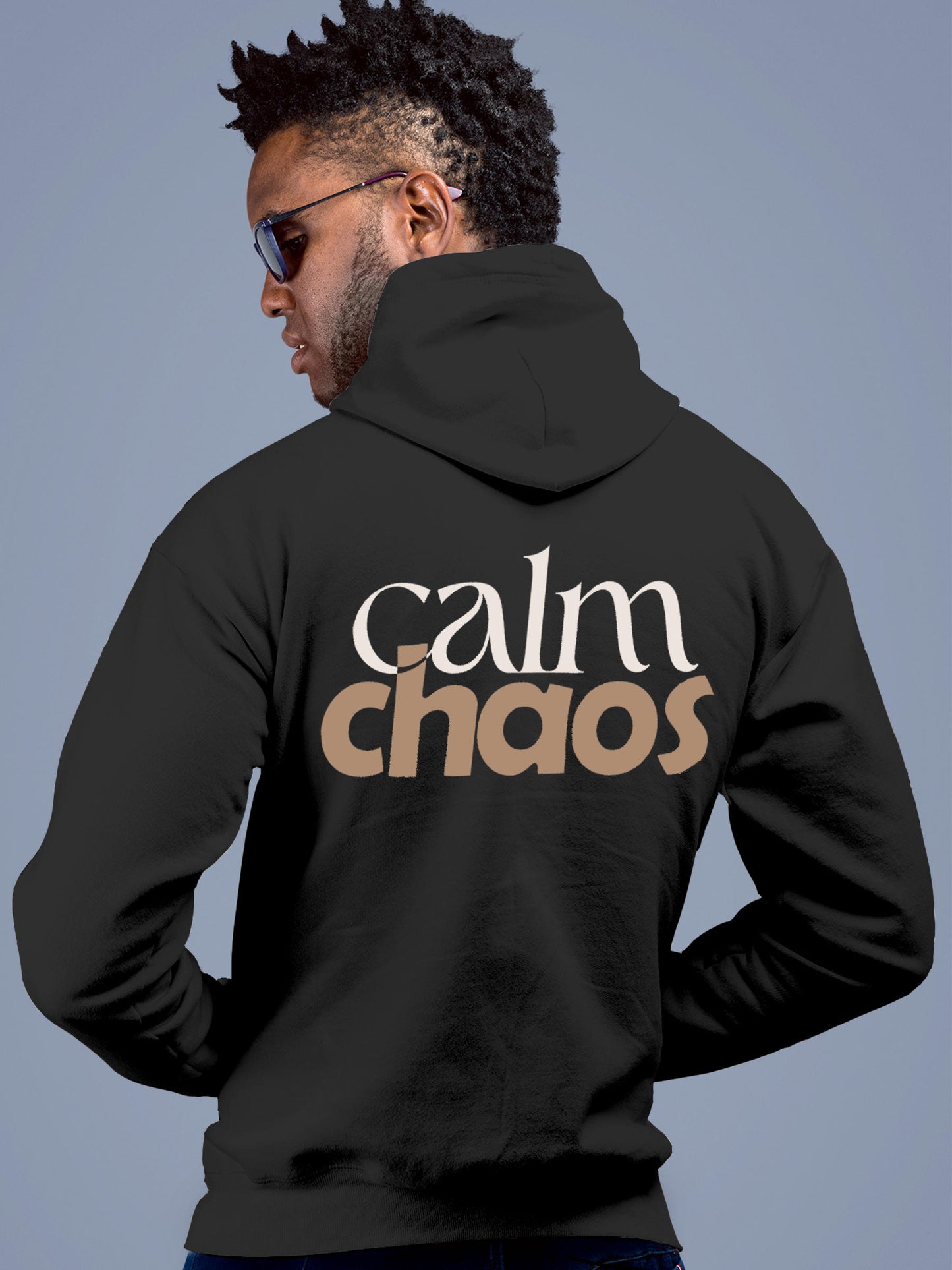 Model wearing Men's Dark Grey Hoodie Sweatshirt with 'Calm Chaos' design, offering effortless style and premium comfort