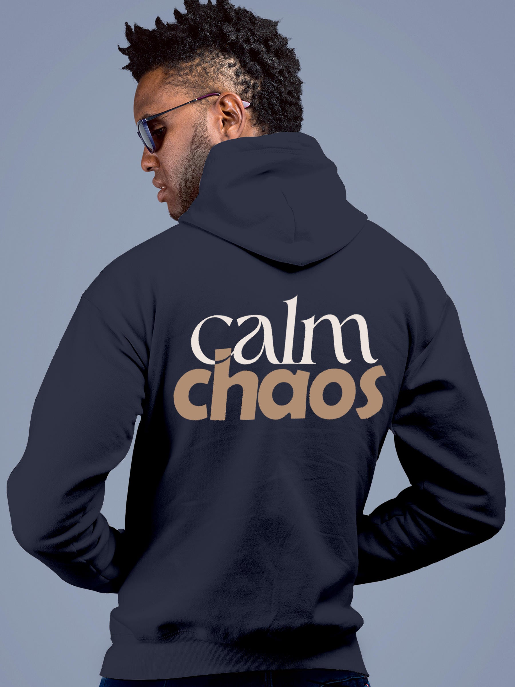 Model wearing Men's Navy Blue Hoodie Sweatshirt with 'Calm Chaos' design, offering effortless style and premium comfort