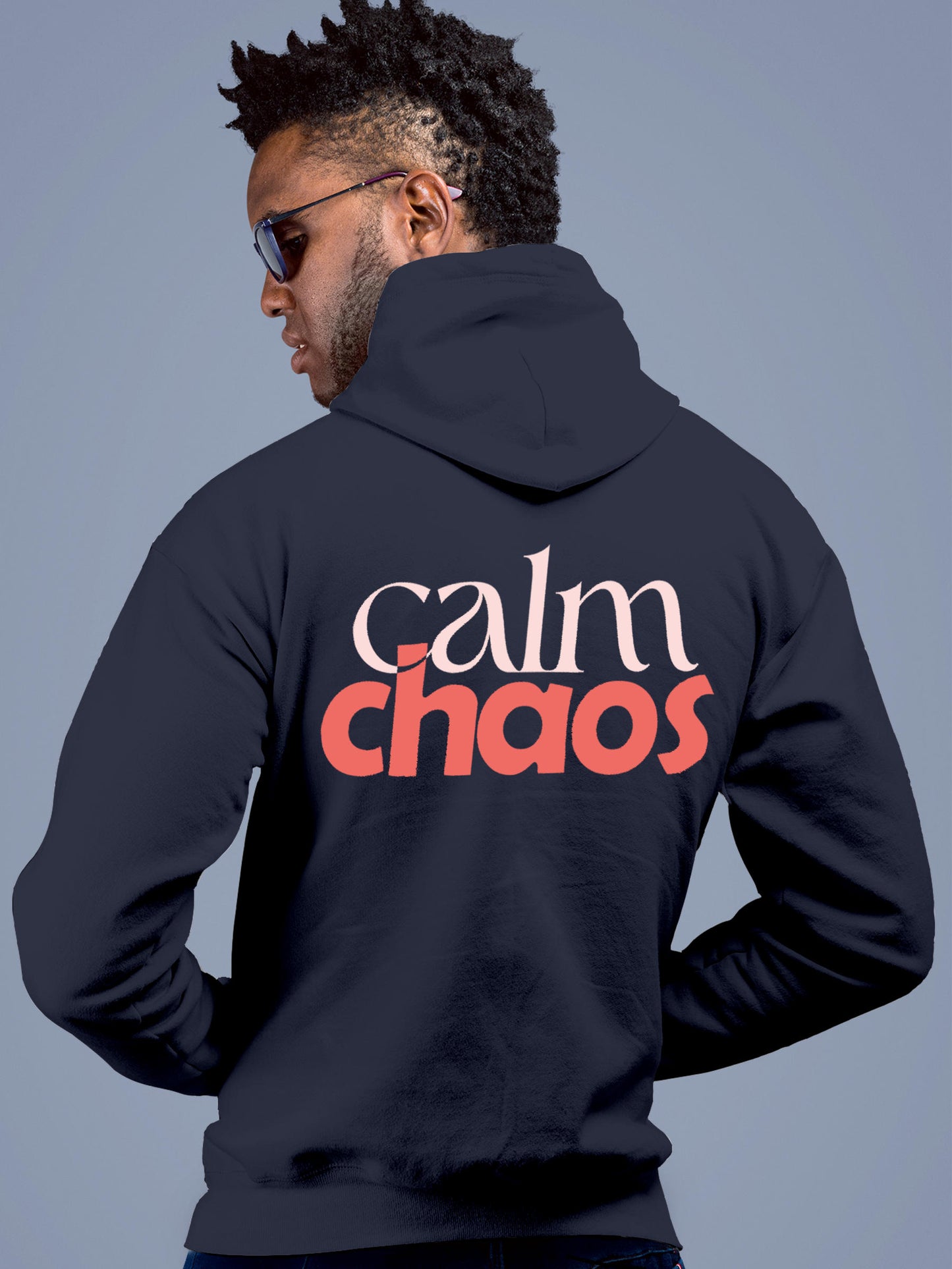 Model wearing Men's Navy Blue Hoodie Sweatshirt with 'Calm Chaos' design, offering effortless style and premium comfort