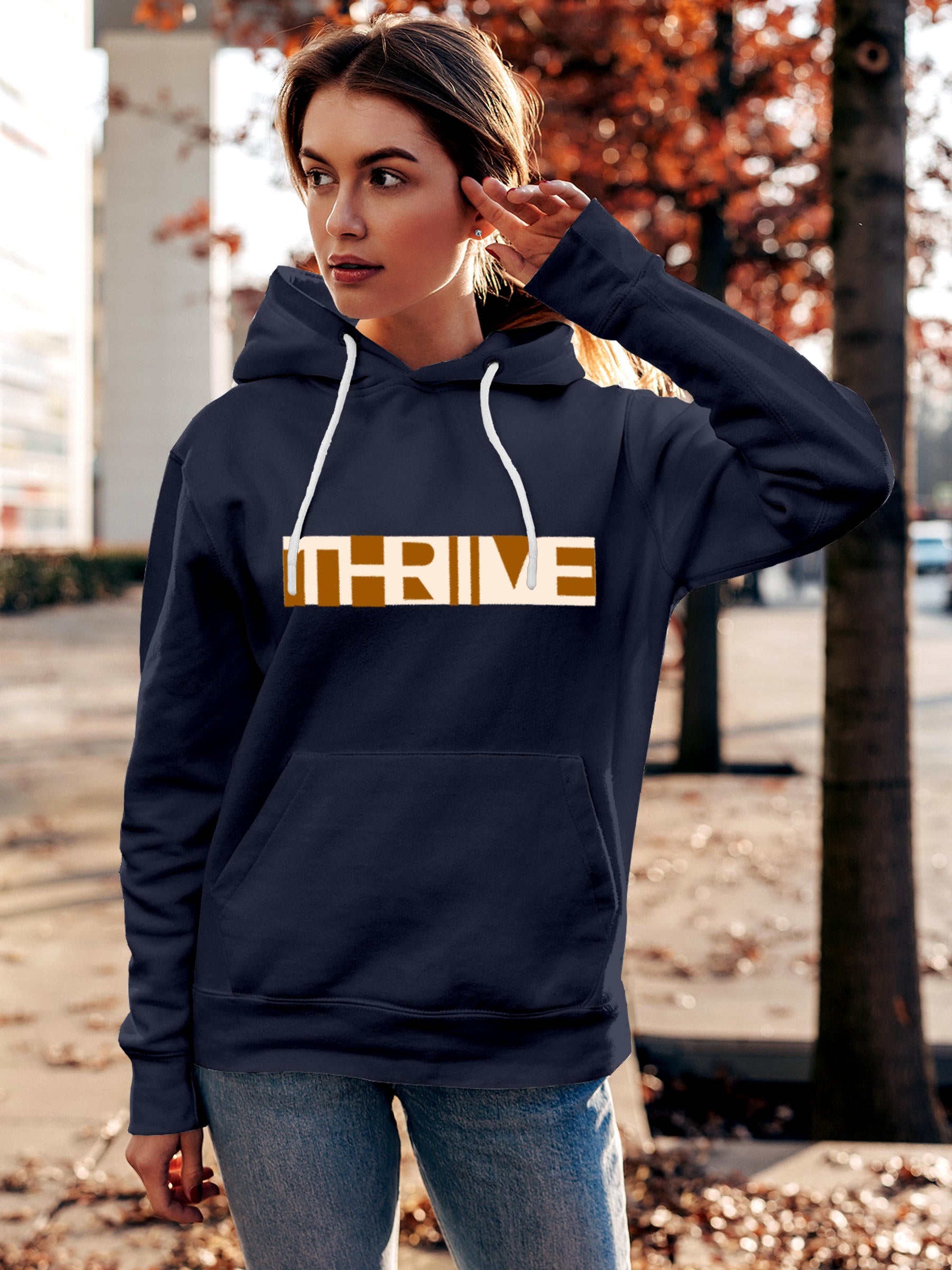 Model wearing Women's Navy Blue Hoodie Sweatshirt with 'Thrive' design, offering effortless style and premium comfort