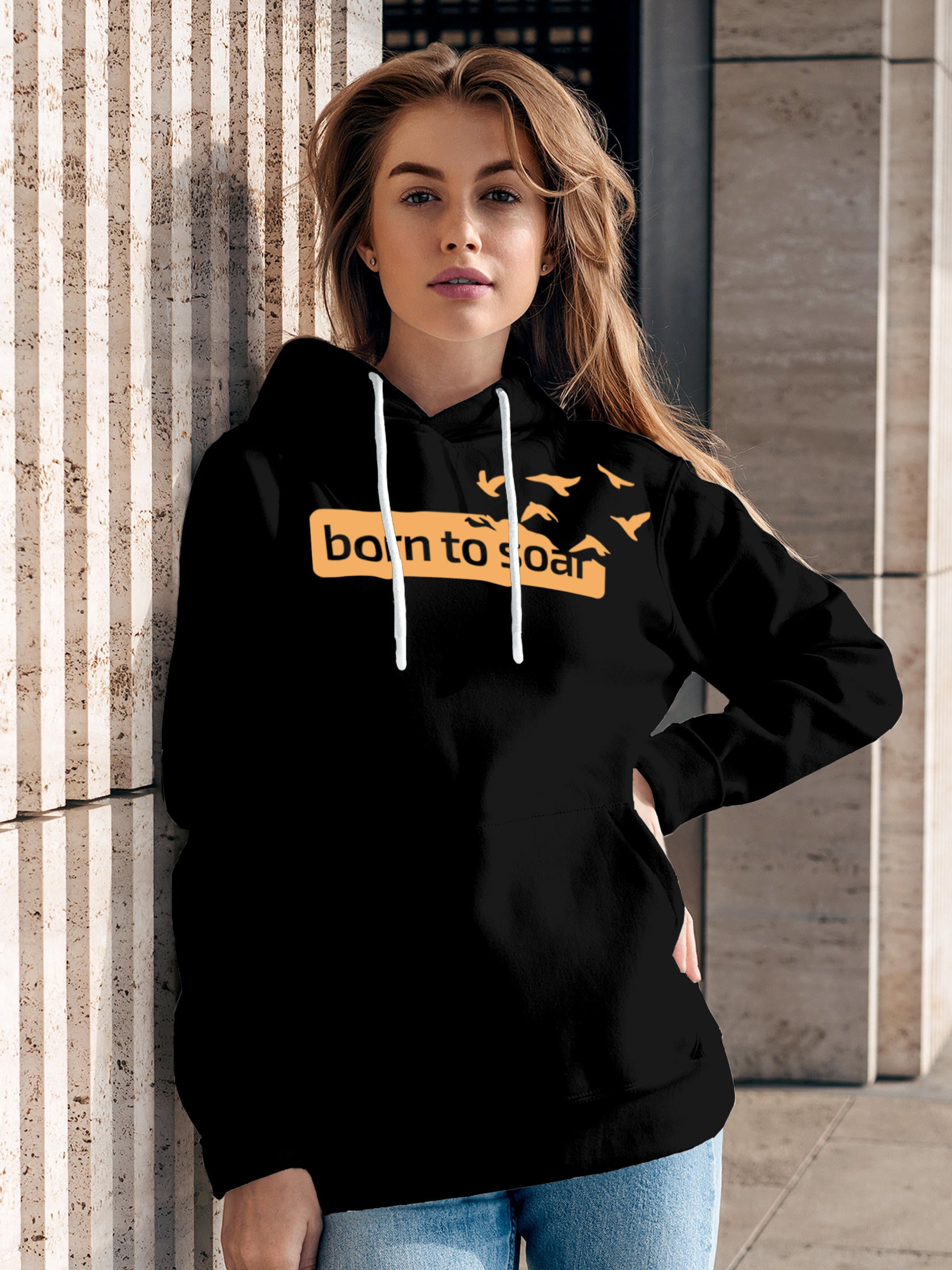 Model wearing Women's Black Hoodie Sweatshirt with 'Born To Soar' design, offering effortless style and premium comfort
