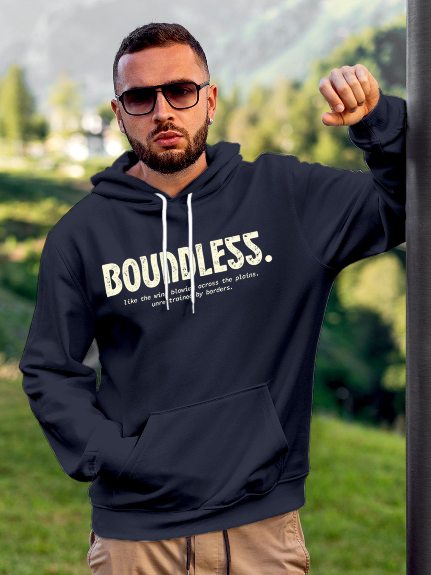 Model wearing Men's Navy Blue Hoodie Sweatshirt with 'Boundless' design, offering effortless style and premium comfort