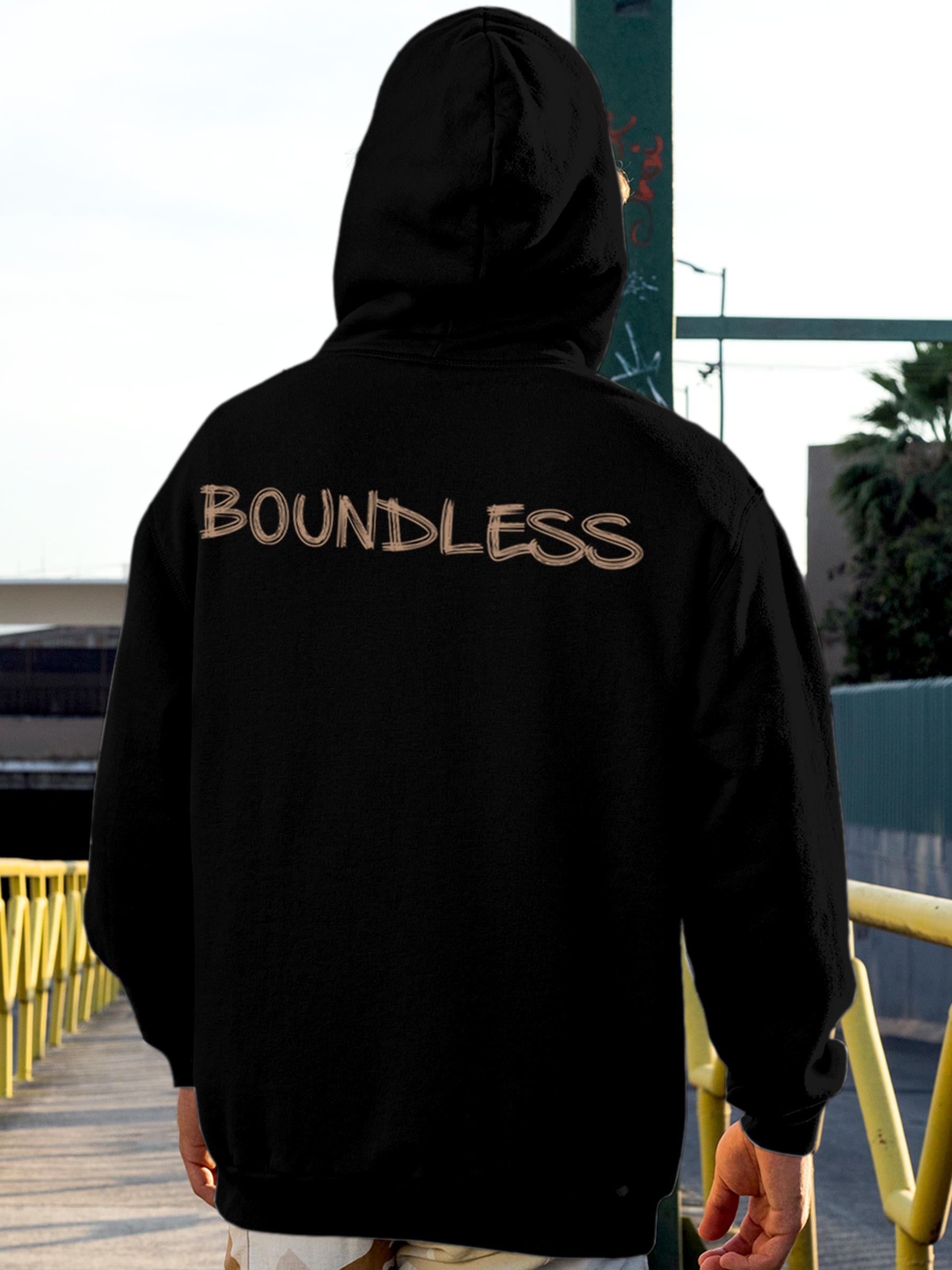 Model wearing Men's Black Hoodie Sweatshirt with 'Boundless' design, offering effortless style and premium comfort