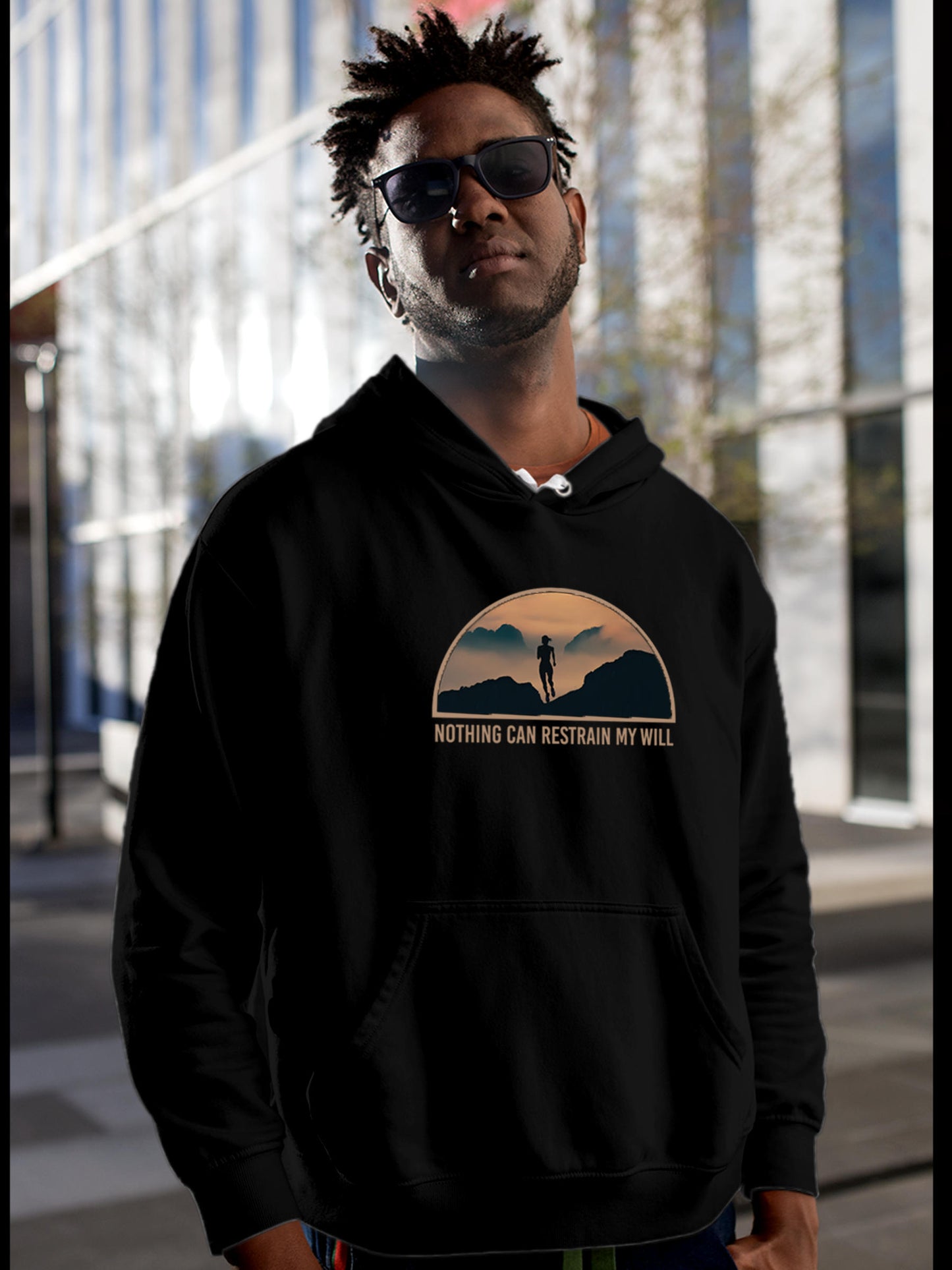 Model wearing Men's Black Hoodie Sweatshirt with 'Limitless Will' design, offering effortless style and premium comfort