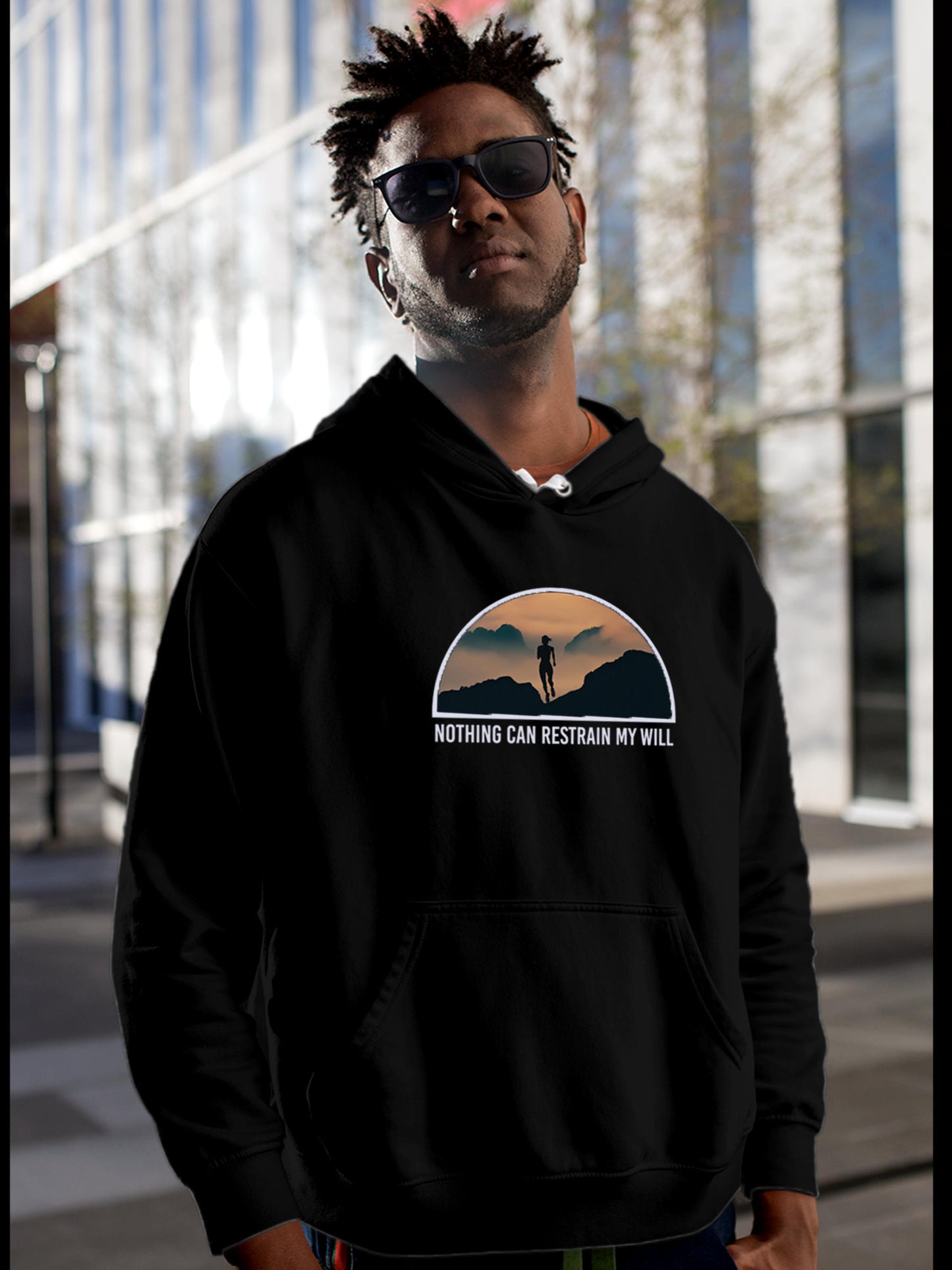 Model wearing Men's Black Hoodie Sweatshirt with 'Limitless Will' design, offering effortless style and premium comfort