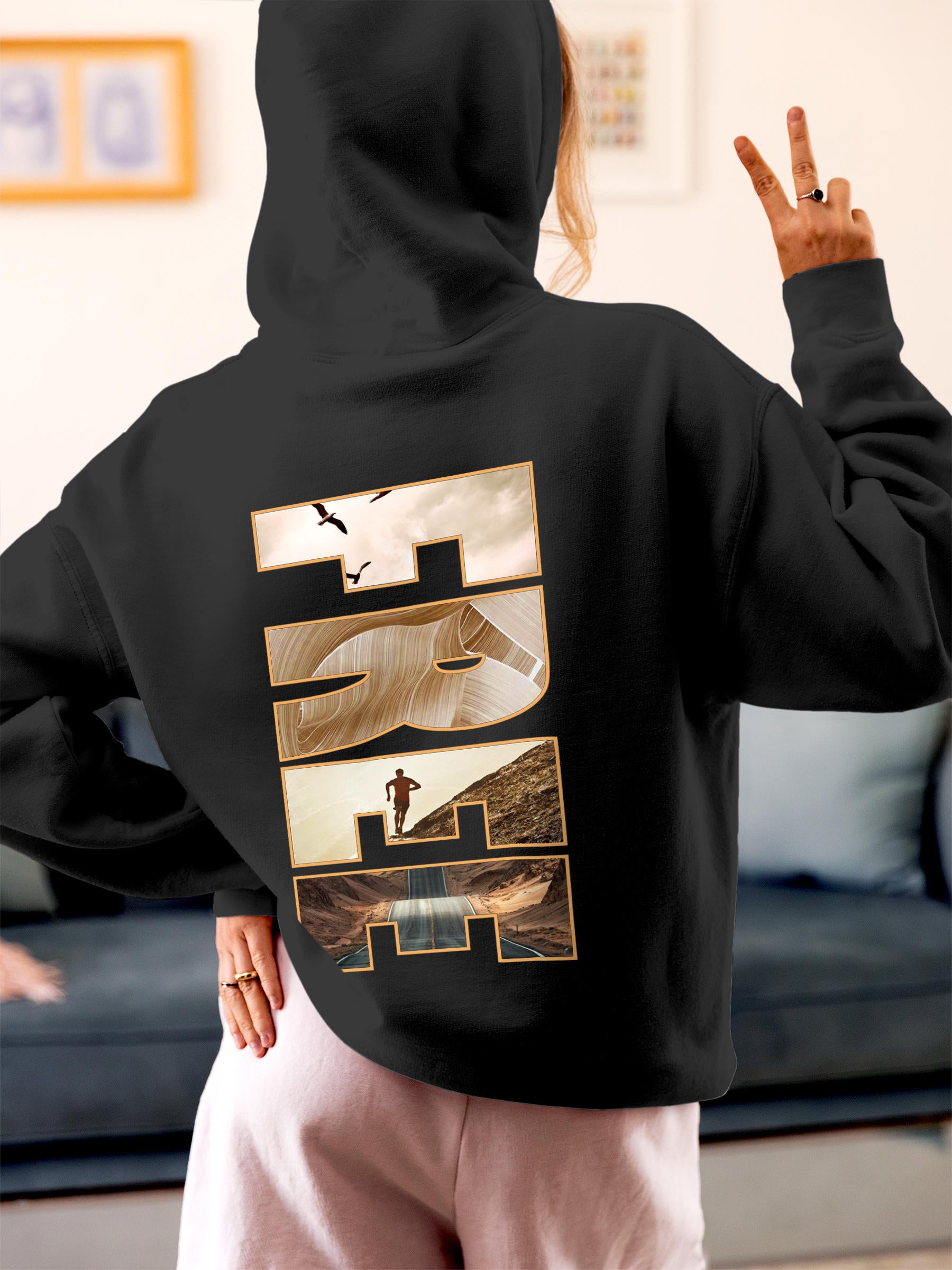 Model wearing Women's Dark Grey Hoodie Sweatshirt with 'Free & Boundless' design, offering effortless style and premium comfort