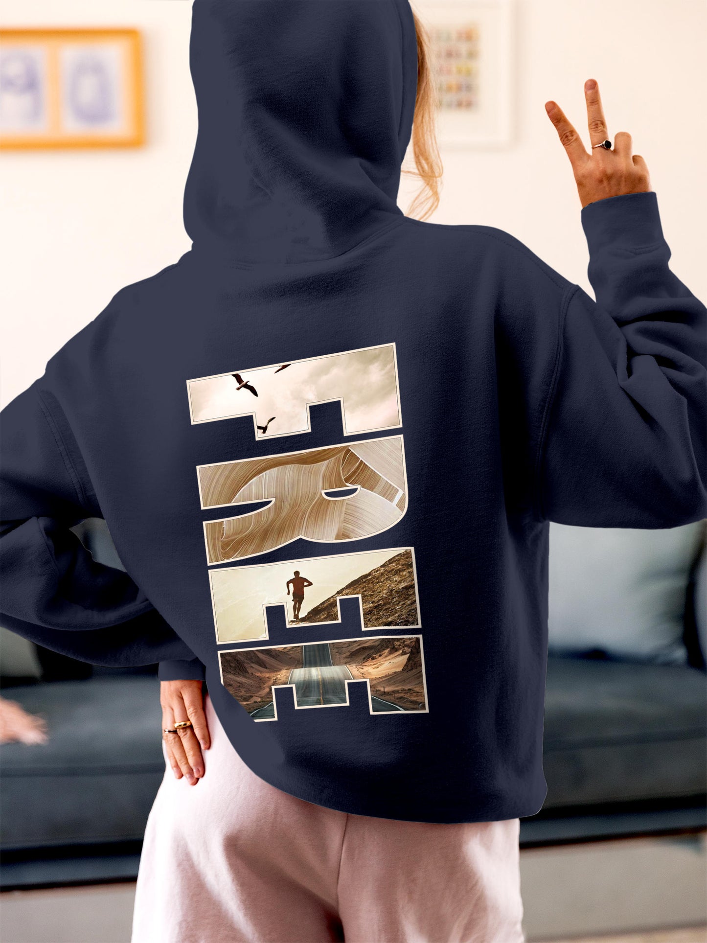 Model wearing Women's Navy Blue Hoodie Sweatshirt with 'Free & Boundless' design, offering effortless style and premium comfort
