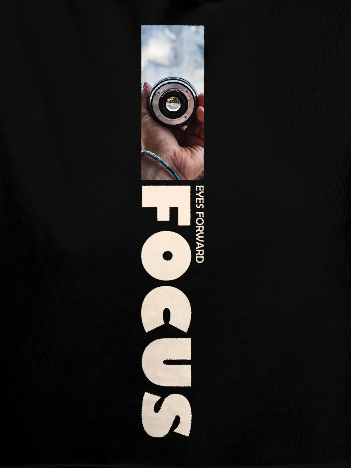 Close up of 'Focus' design on Women's Black Hoodie Sweatshirt, highlighting intricate details and vibrant print.