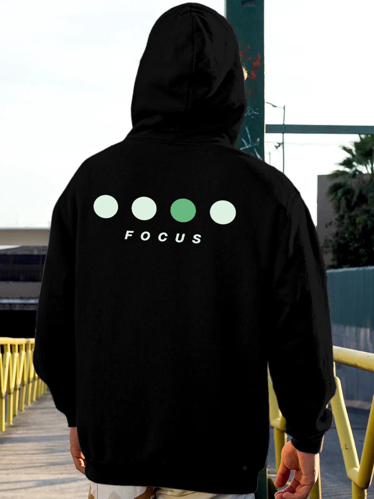 Model wearing Men's Black Hoodie Sweatshirt with 'Focus On Goal' design, offering effortless style and premium comfort