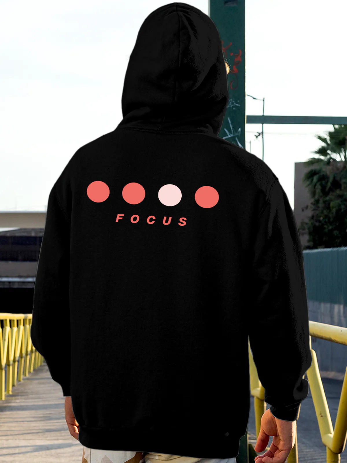 Model wearing Men's Black Hoodie Sweatshirt with 'Focus On Goal' design, offering effortless style and premium comfort