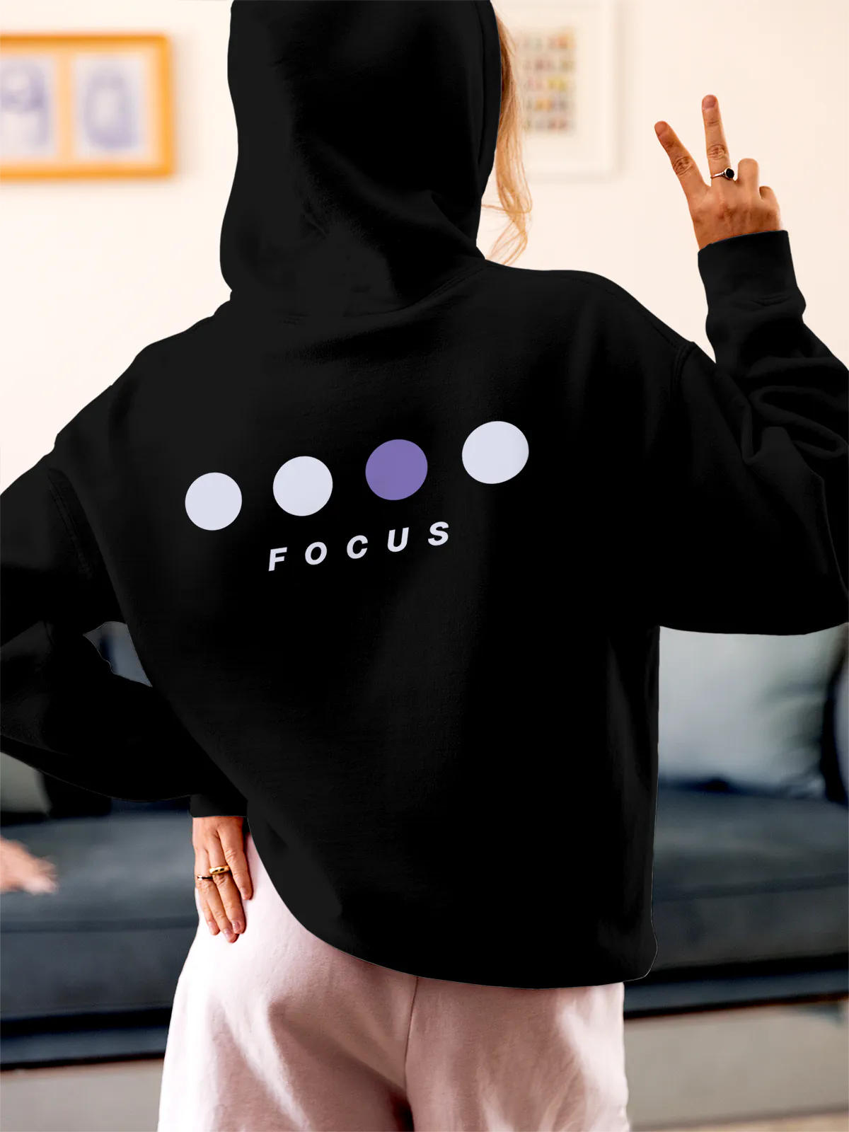 Model wearing Women's Black Hoodie Sweatshirt with 'Focus On Goal' design, offering effortless style and premium comfort