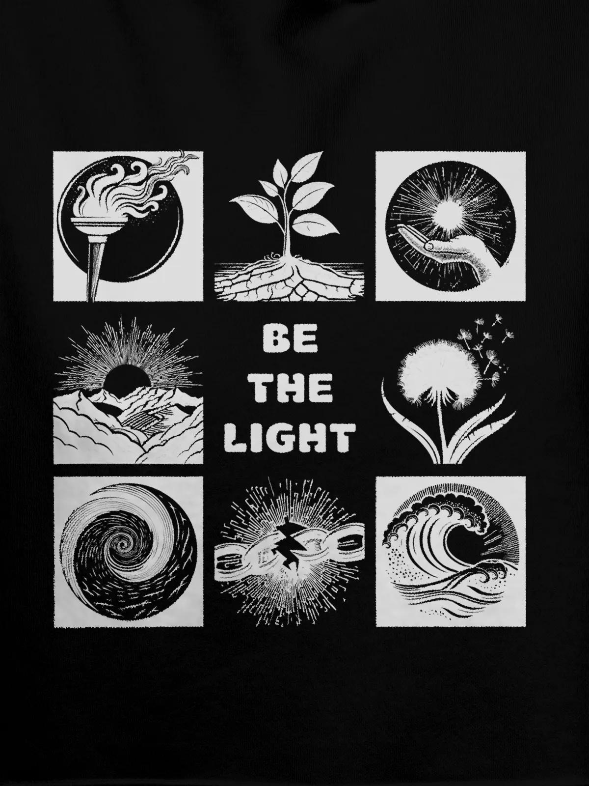 Close up of 'Be The Light' design on Women's Black Hoodie Sweatshirt, highlighting intricate details and vibrant print.