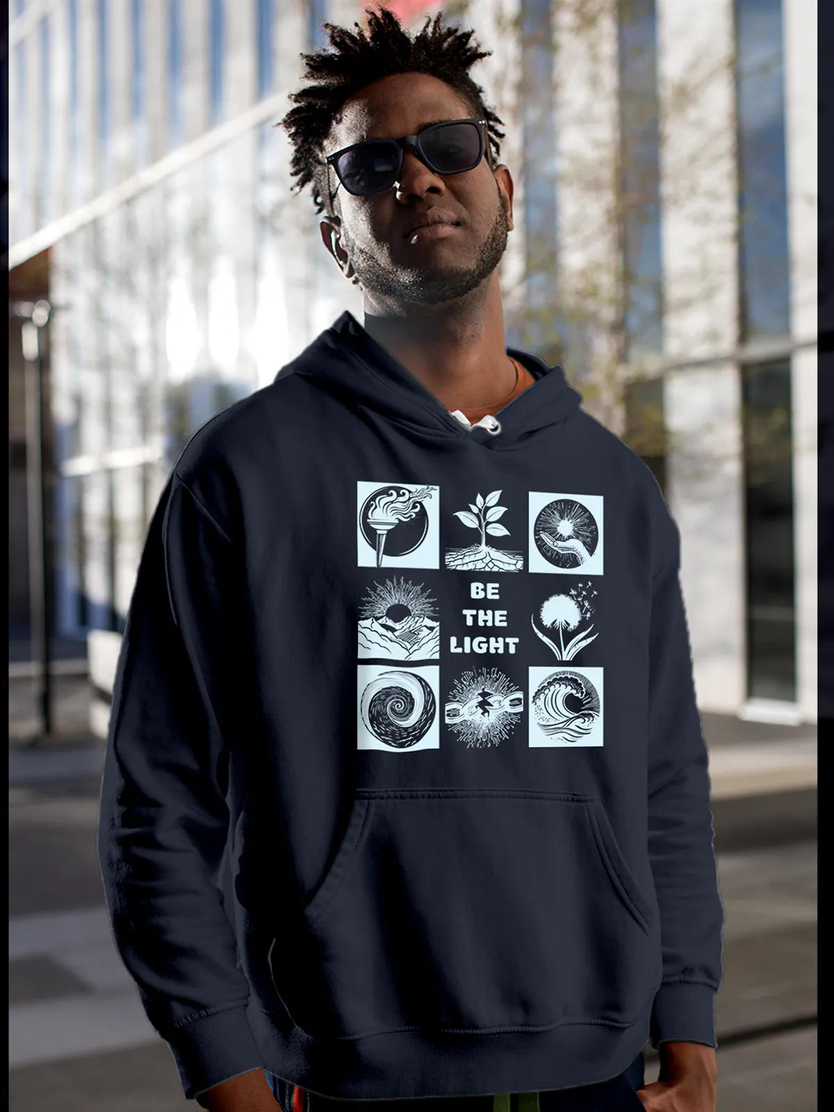 Model wearing Men's Navy Blue Hoodie Sweatshirt with 'Be The Light' design, offering effortless style and premium comfort