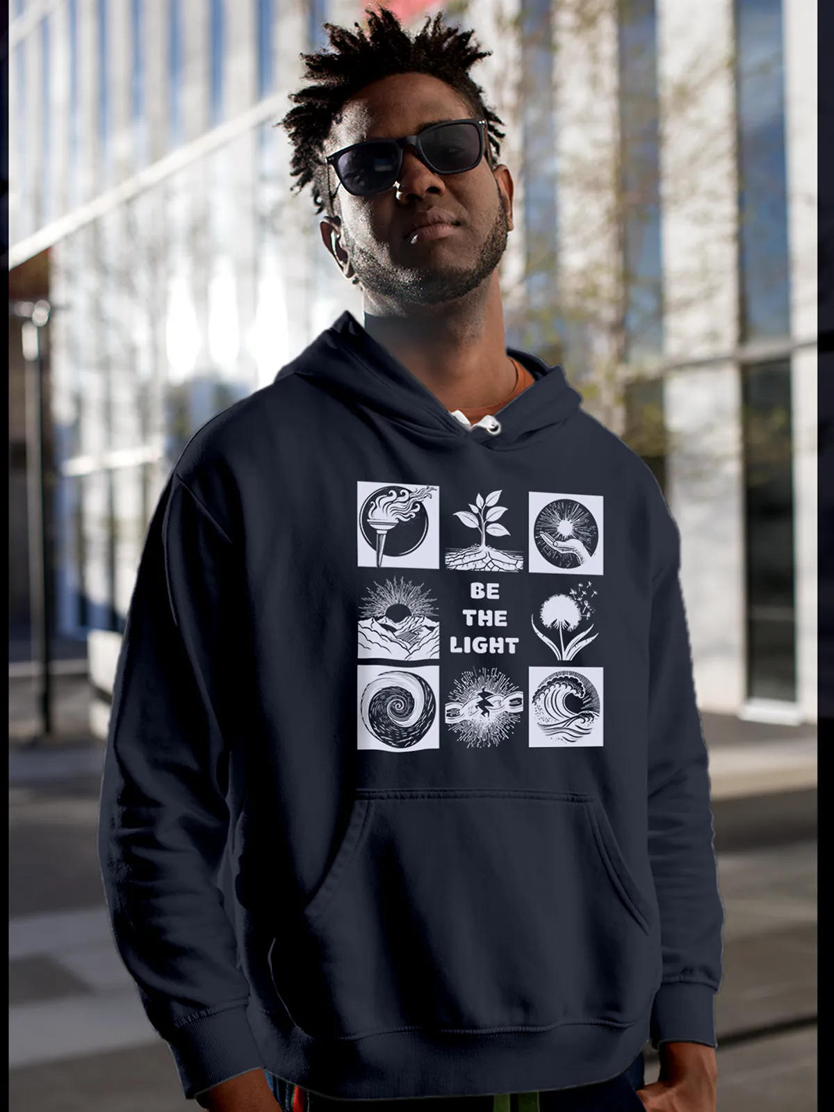 Model wearing Men's Navy Blue Hoodie Sweatshirt with 'Be The Light' design, offering effortless style and premium comfort