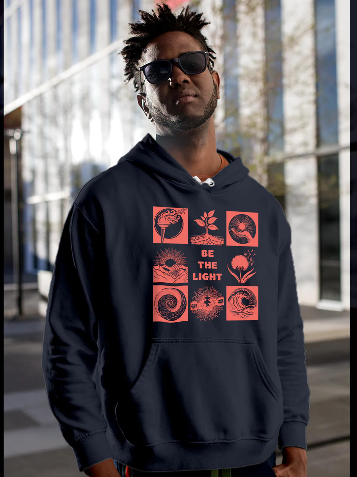 Model wearing Men's Navy Blue Hoodie Sweatshirt with 'Be The Light' design, offering effortless style and premium comfort