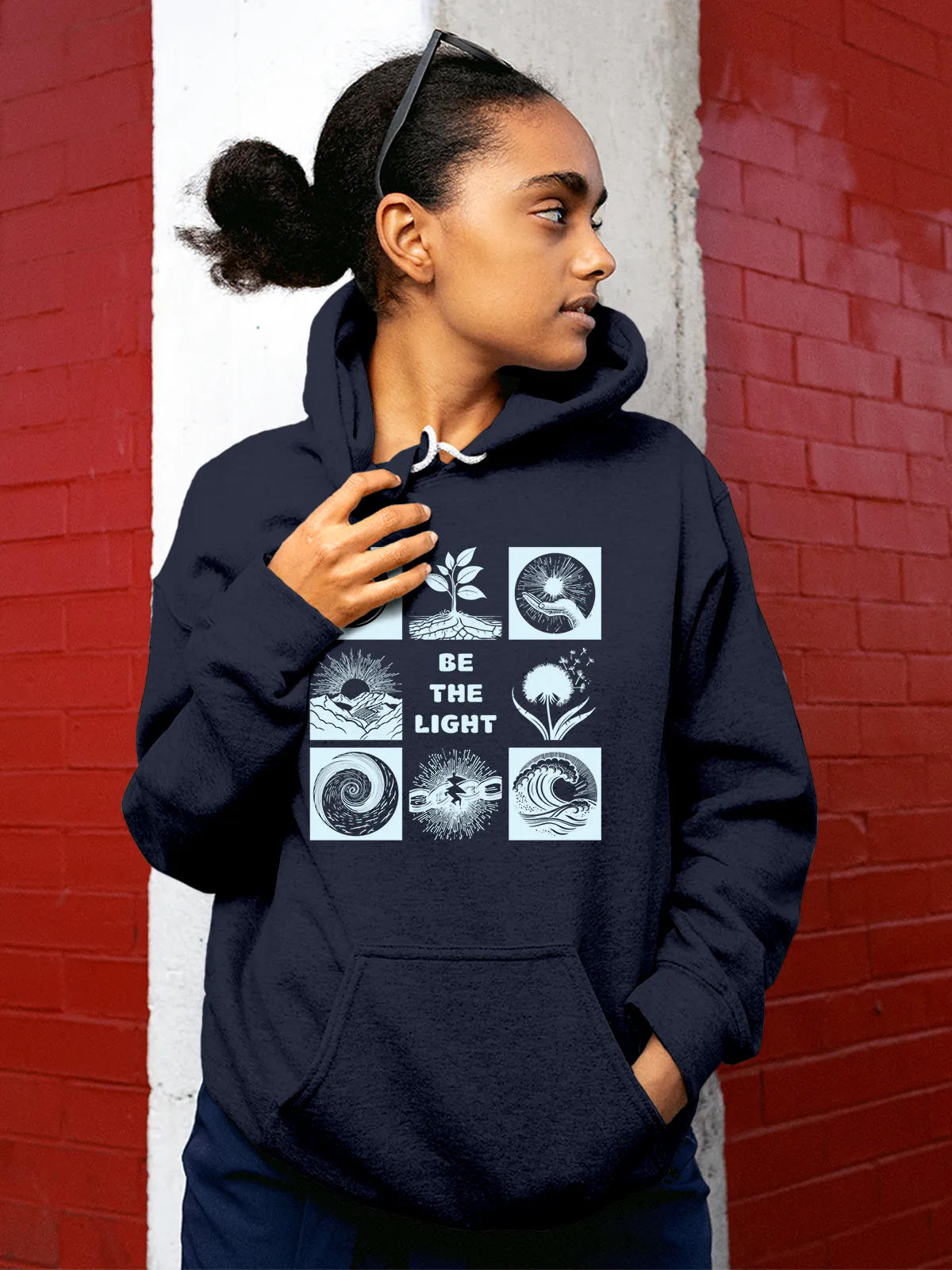 Model wearing Women's Navy Blue Hoodie Sweatshirt with 'Be The Light' design, offering effortless style and premium comfort