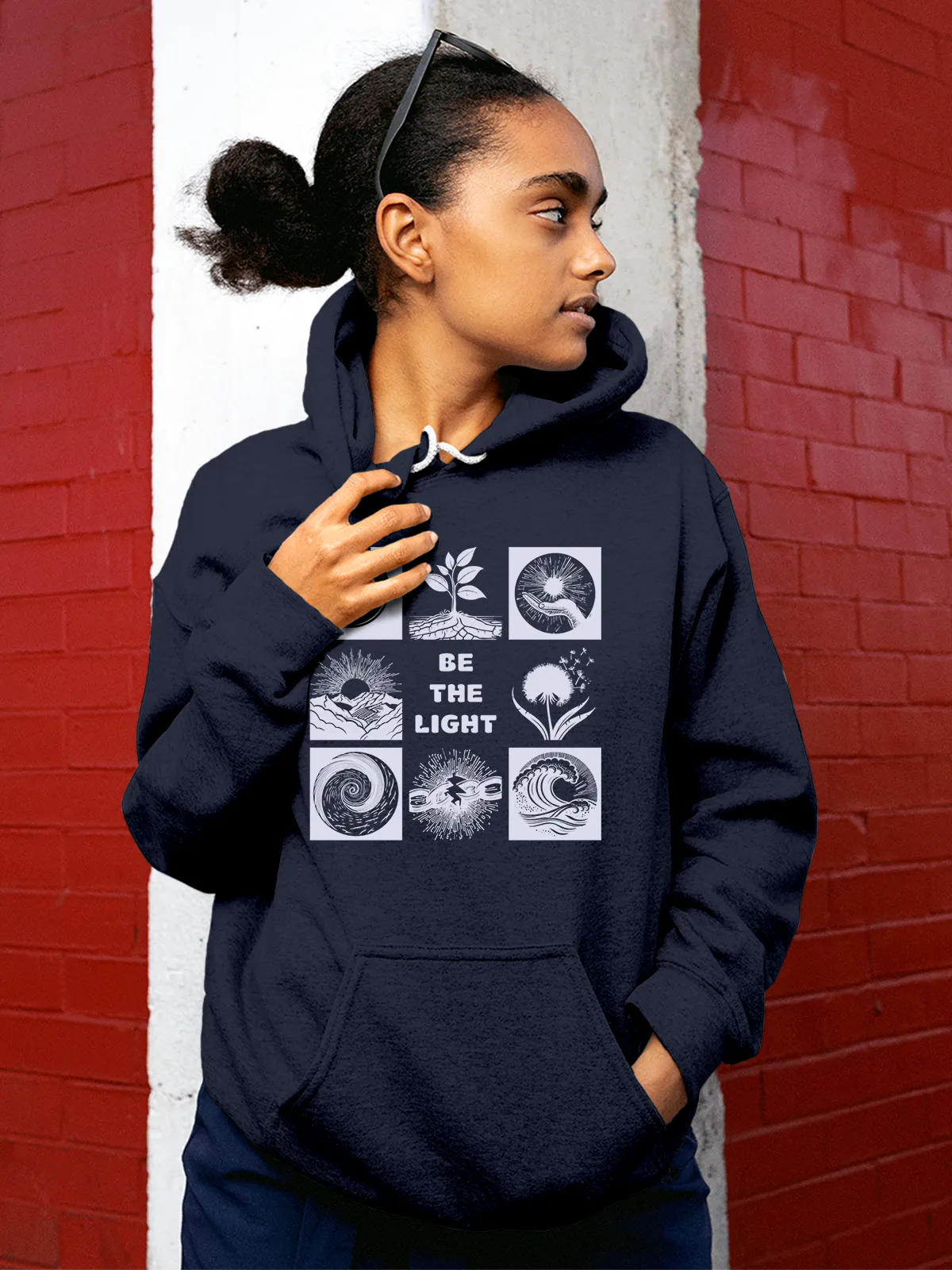 Model wearing Women's Navy Blue Hoodie Sweatshirt with 'Be The Light' design, offering effortless style and premium comfort