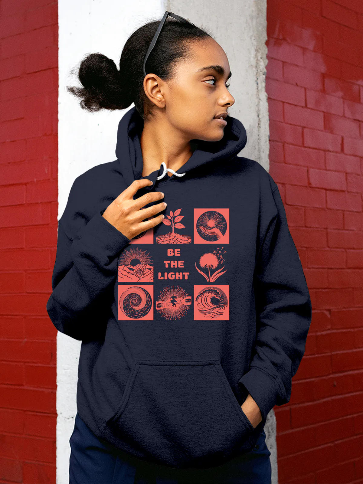 Model wearing Women's Navy Blue Hoodie Sweatshirt with 'Be The Light' design, offering effortless style and premium comfort