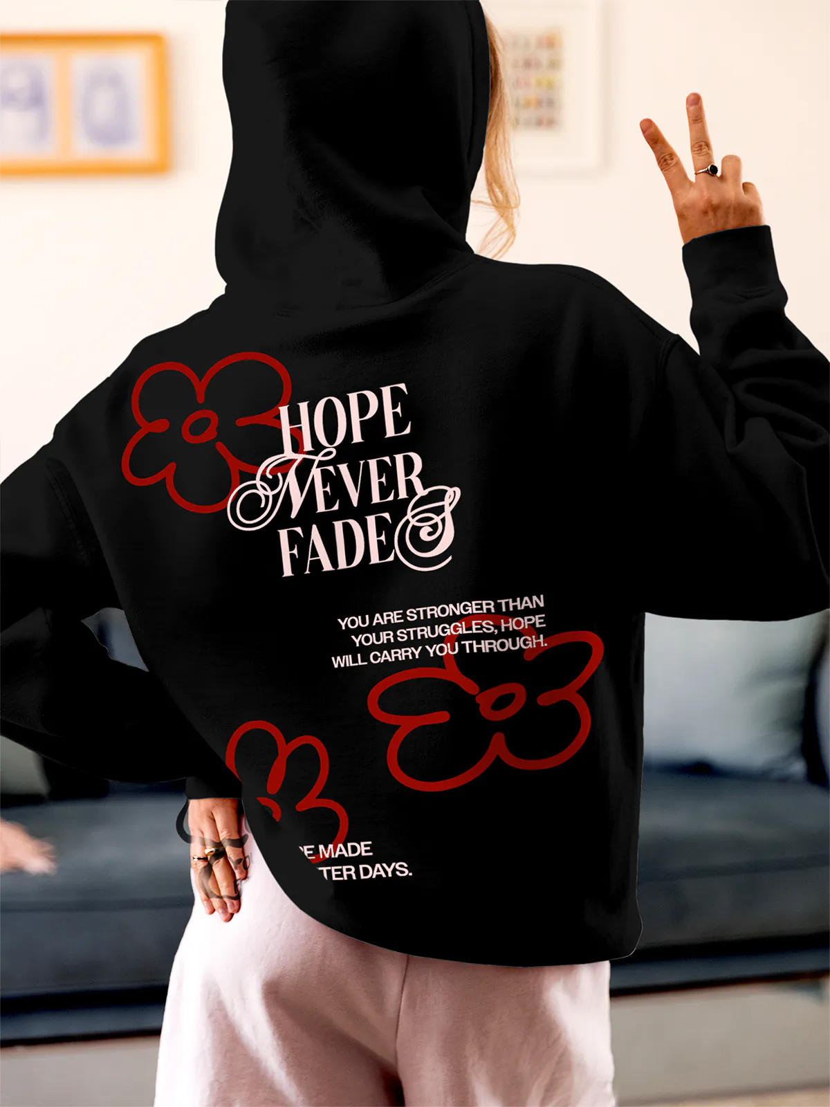 Model wearing Women's Black Hoodie Sweatshirt with 'Hope Never Fades' design, offering effortless style and premium comfort