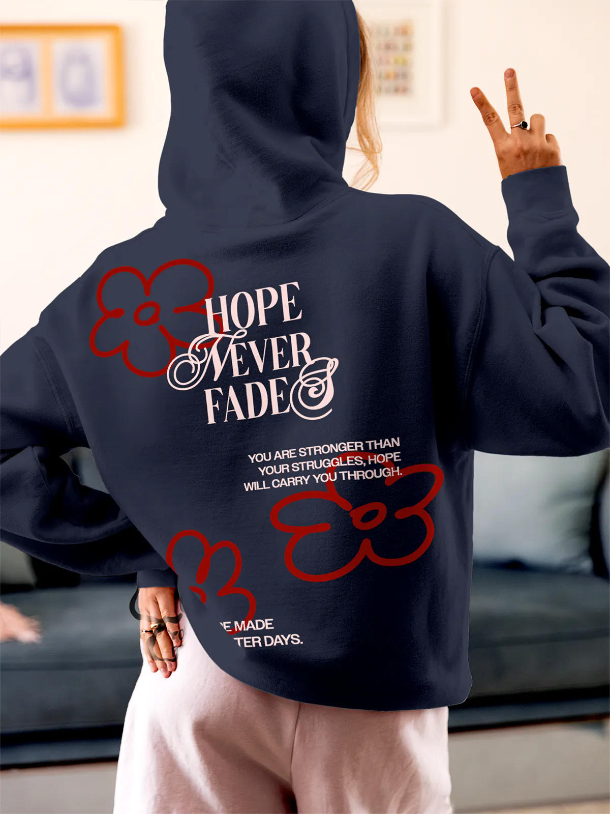 Model wearing Women's Navy Blue Hoodie Sweatshirt with 'Hope Never Fades' design, offering effortless style and premium comfort