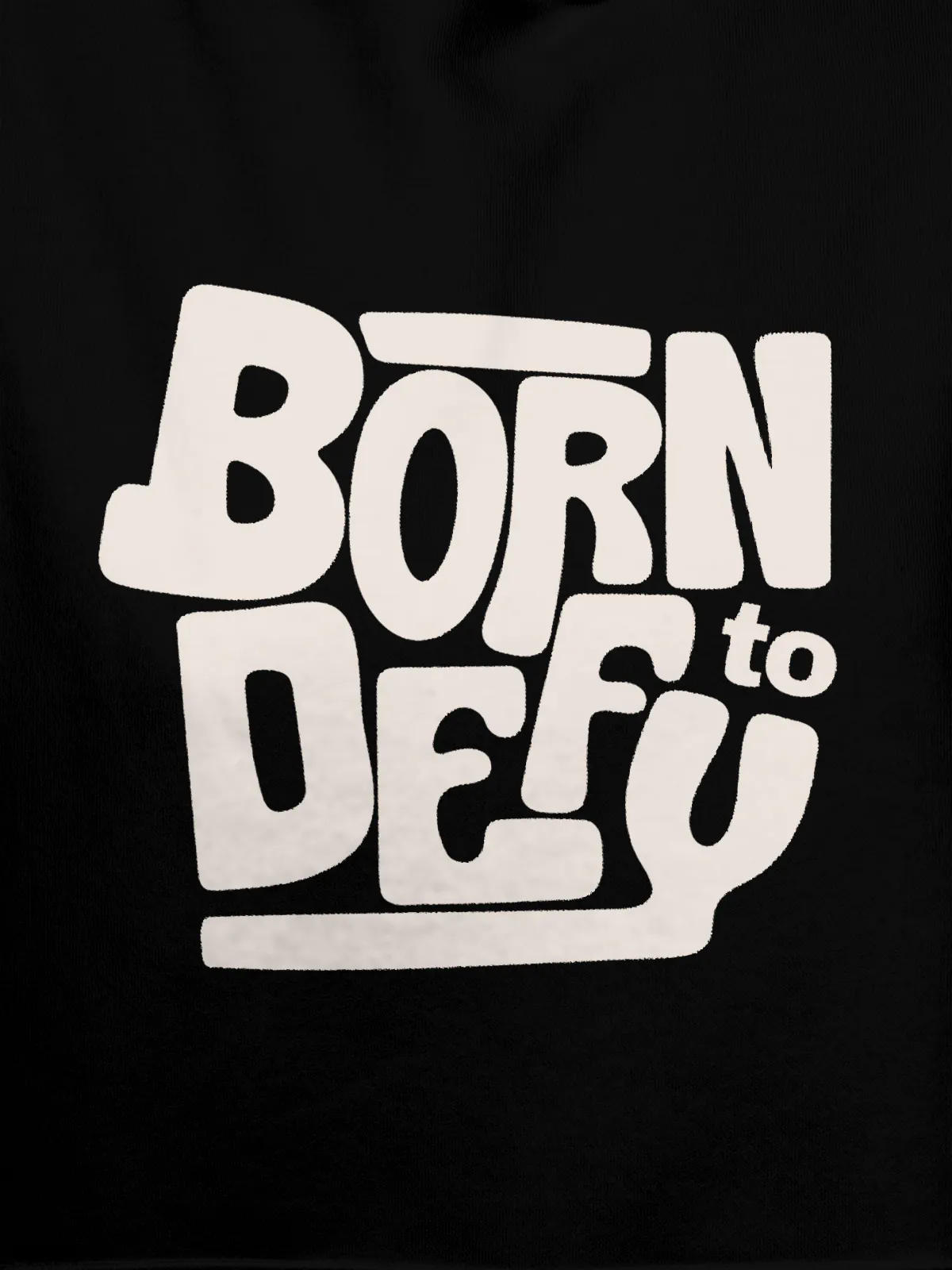 Close up of 'Born To Defy' design on Men's Black Hoodie Sweatshirt, highlighting intricate details and vibrant print.