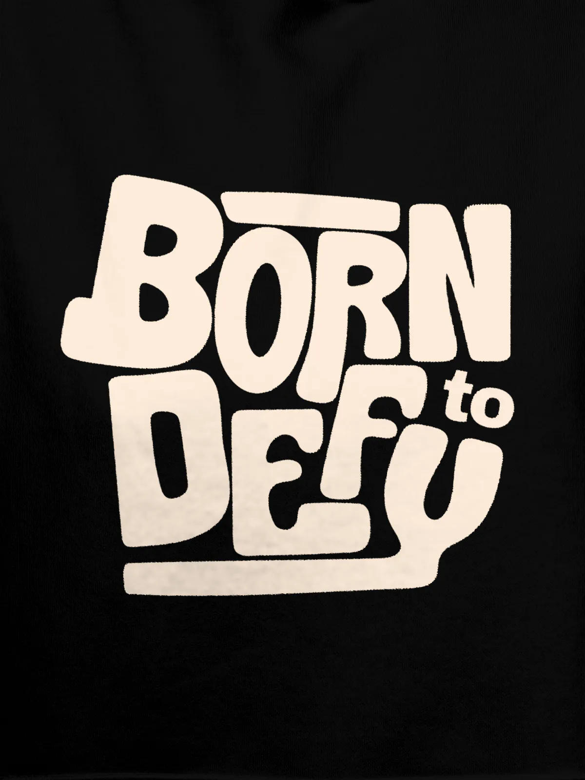 Close up of 'Born To Defy' design on Men's Black Hoodie Sweatshirt, highlighting intricate details and vibrant print.