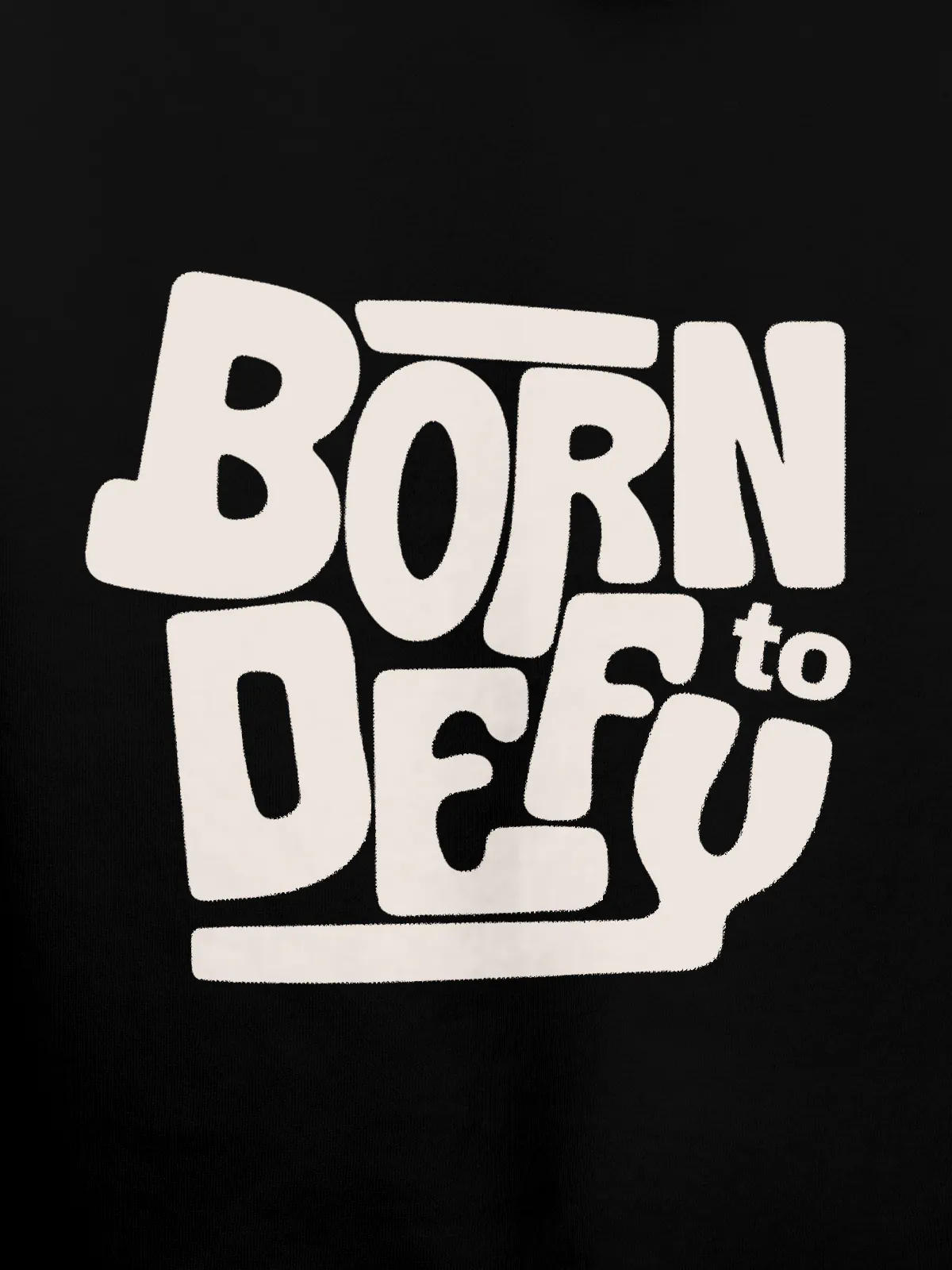 Close up of 'Born To Defy' design on Women's Black Hoodie Sweatshirt, highlighting intricate details and vibrant print.