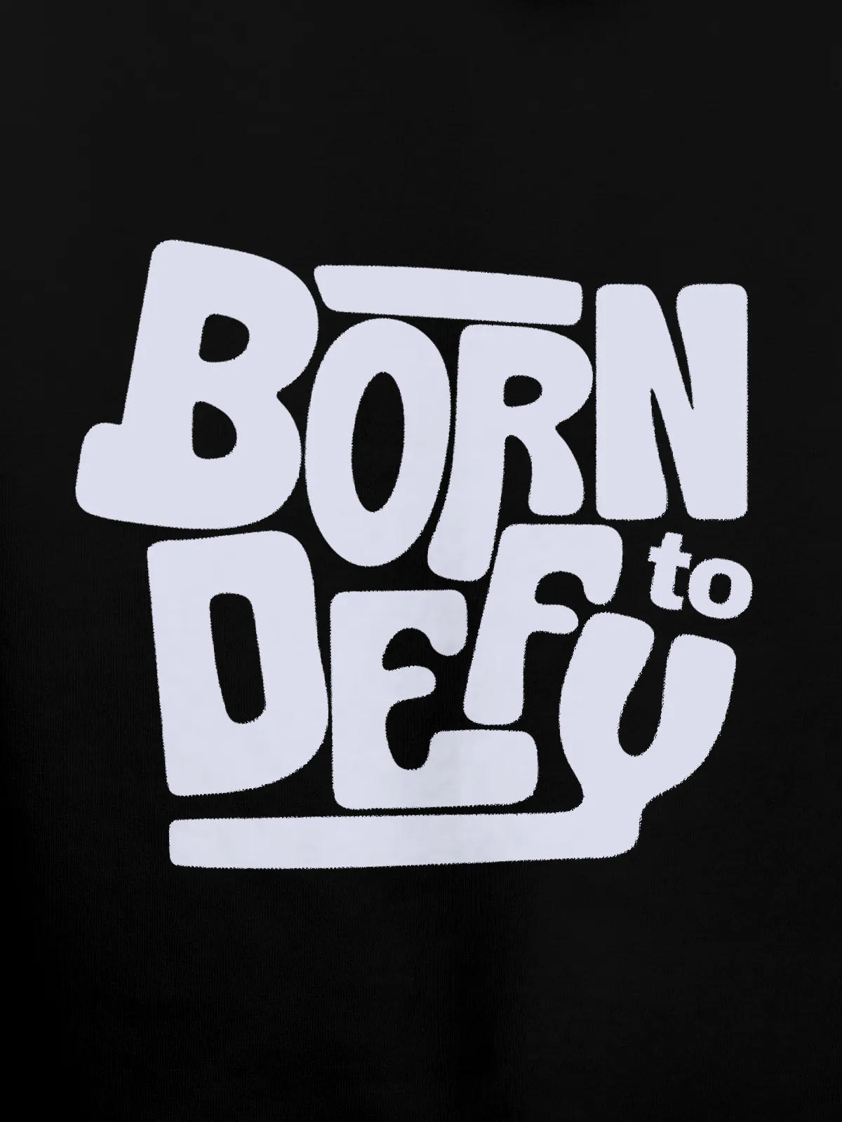 Close up of 'Born To Defy' design on Women's Black Hoodie Sweatshirt, highlighting intricate details and vibrant print.