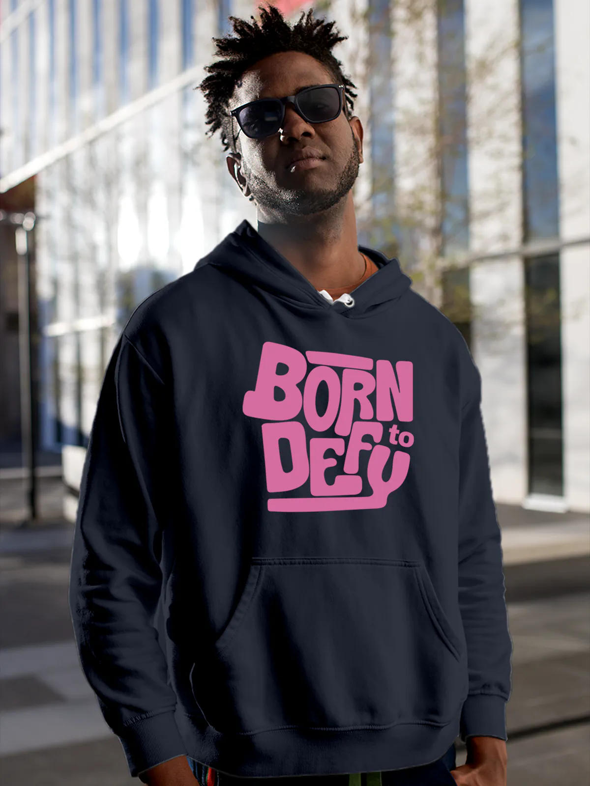 Model wearing Men's Navy Blue Hoodie Sweatshirt with 'Born To Defy' design, offering effortless style and premium comfort