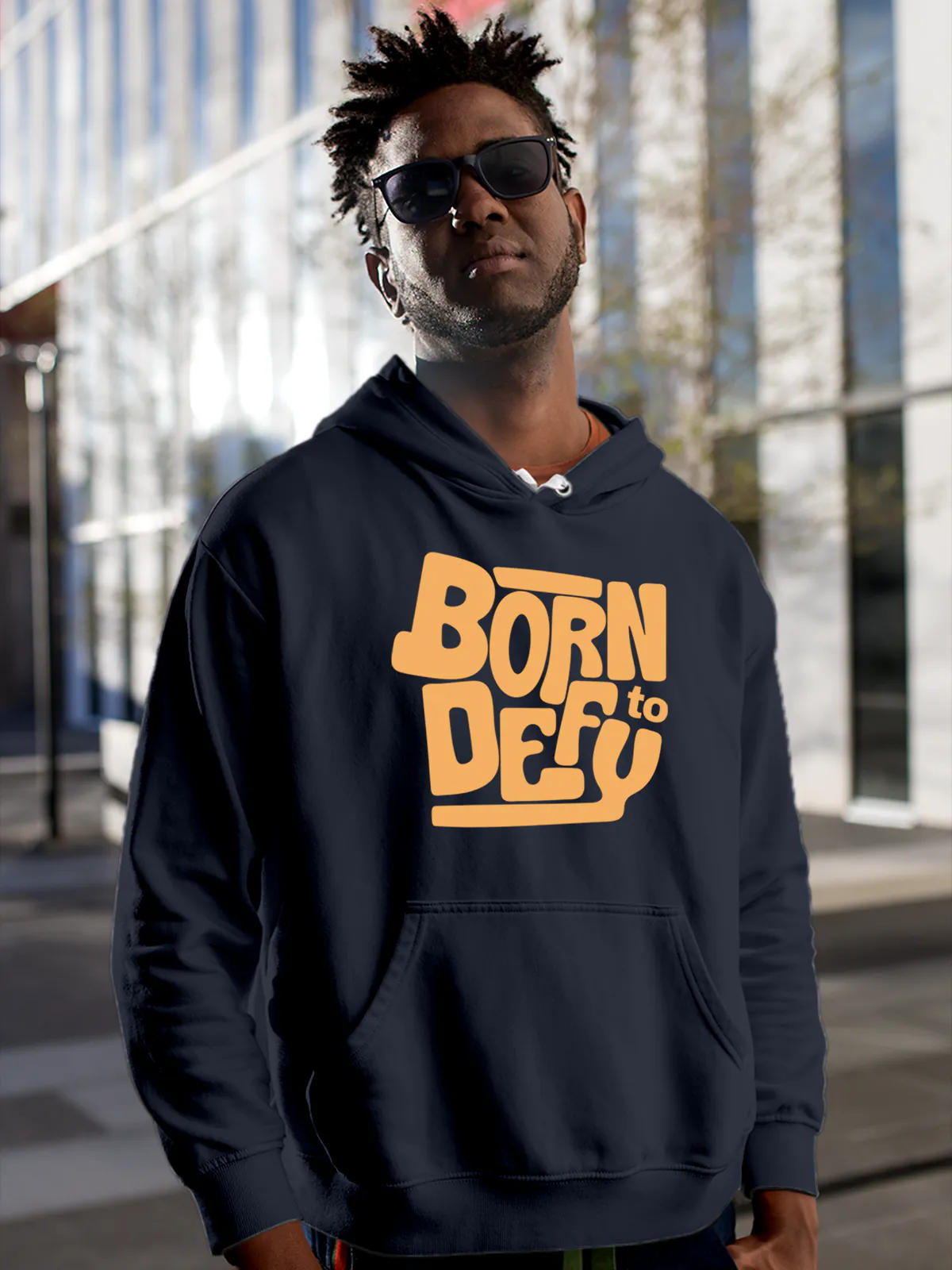 Model wearing Men's Navy Blue Hoodie Sweatshirt with 'Born To Defy' design, offering effortless style and premium comfort